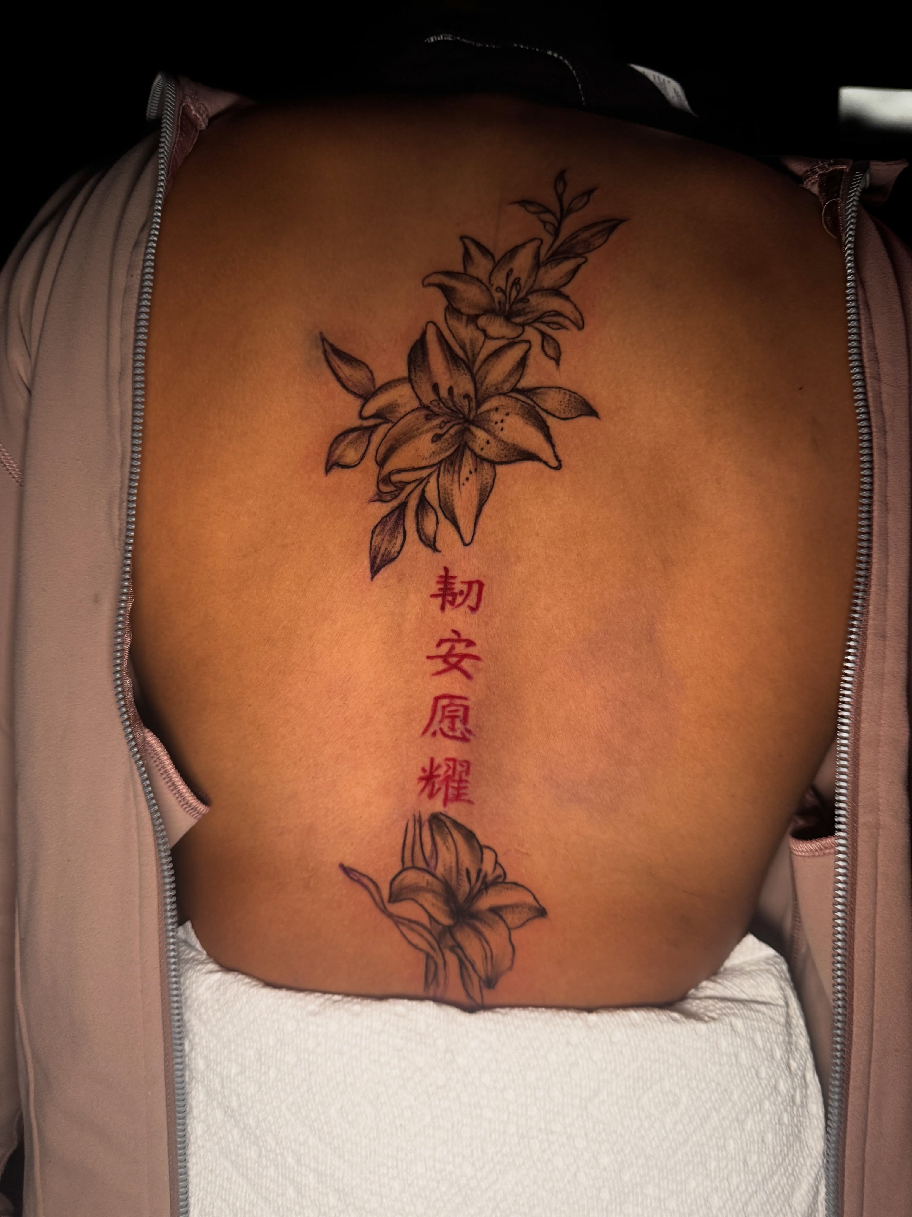 Lilies and Chinese characters black and grey tattoo on the back by dallas tattoo artist, Duncanville, Texas