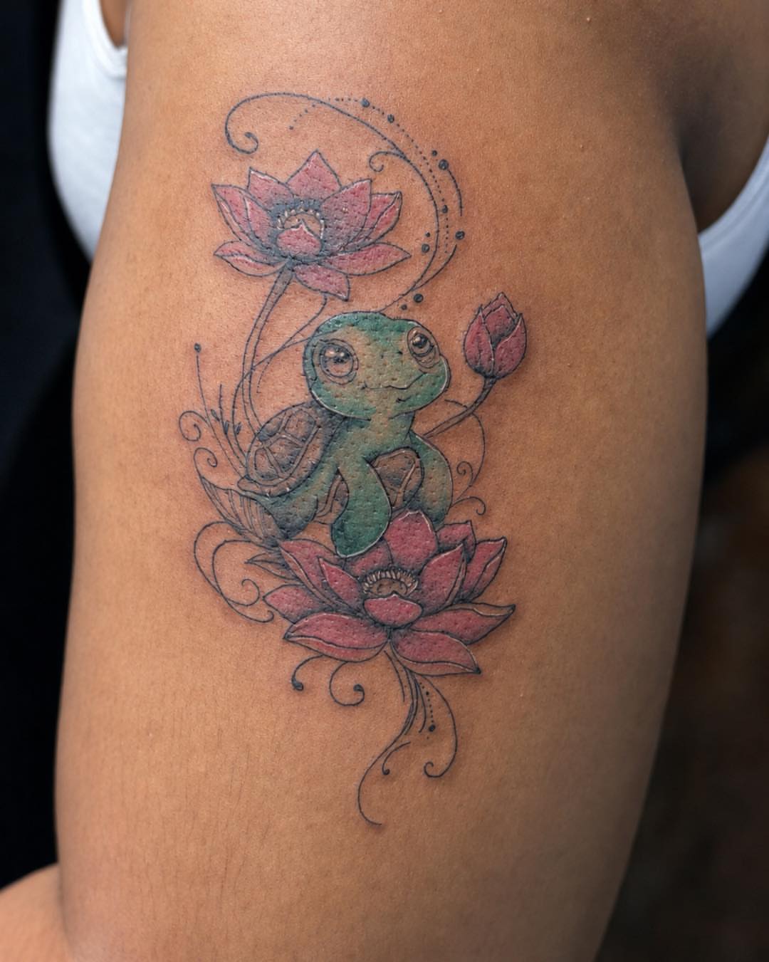 Frog and lotus dotwork tattoo on the thigh by Flamboyant