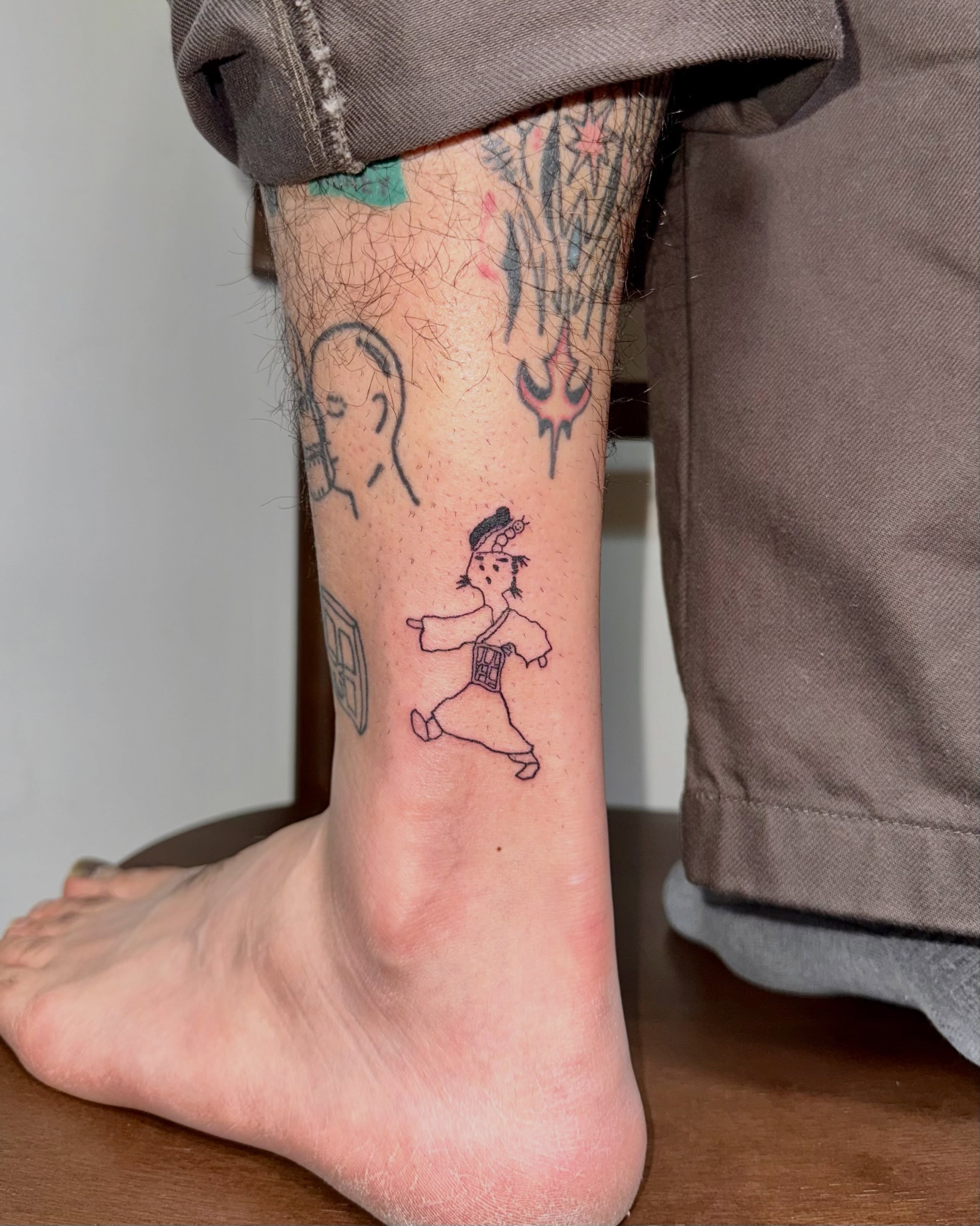Cartoon character anime tattoo on the calf by 림구타투