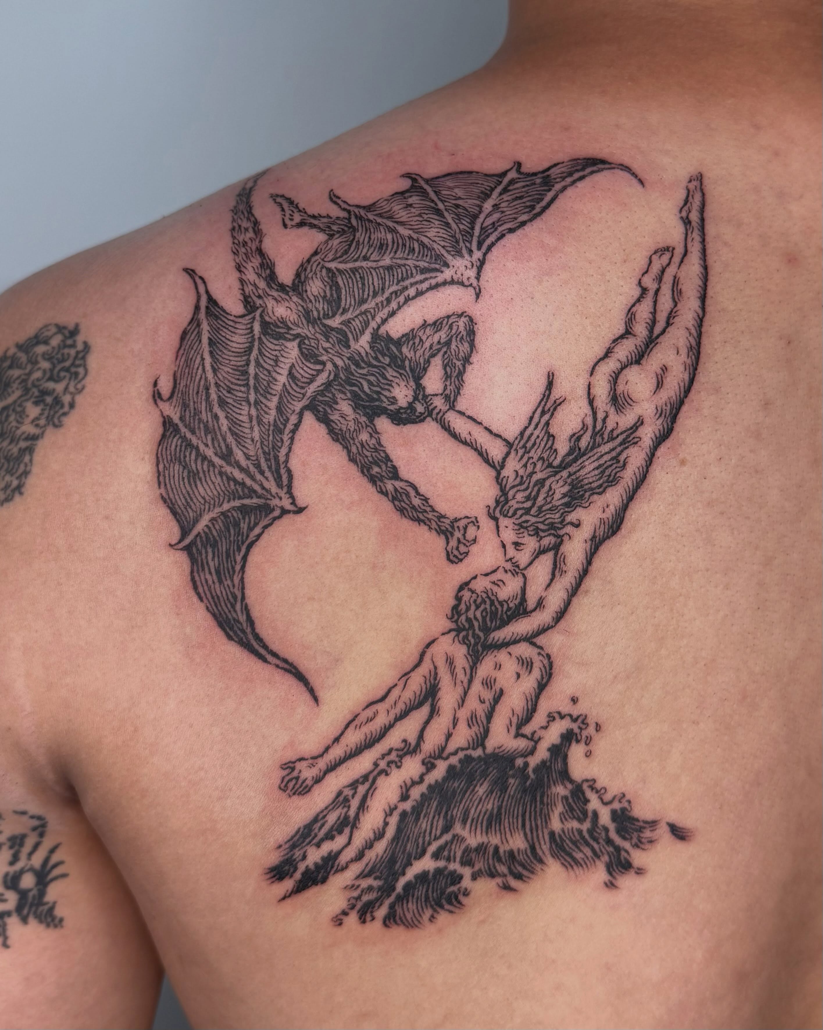 Dragon and angel realism tattoo on the back by Anh Đan