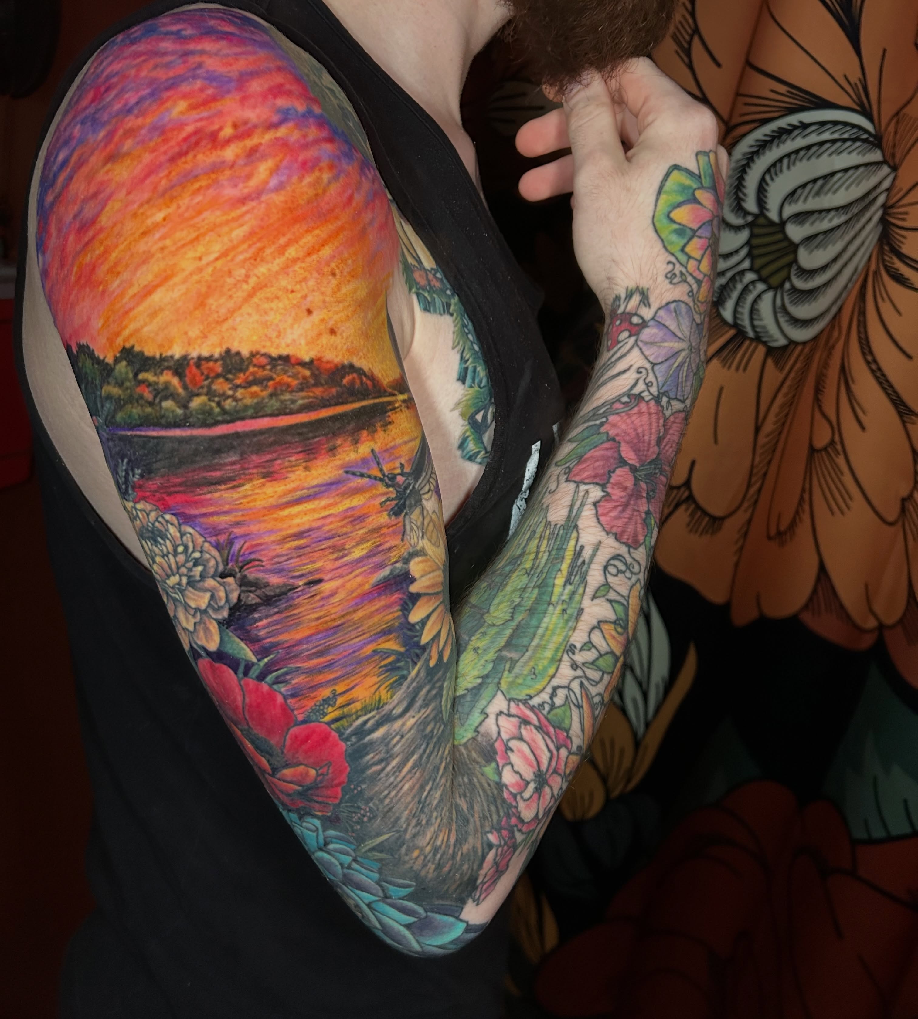 Sunset landscape realism tattoo on the upper arm by Paisley Diaz, Lombard, Illinois