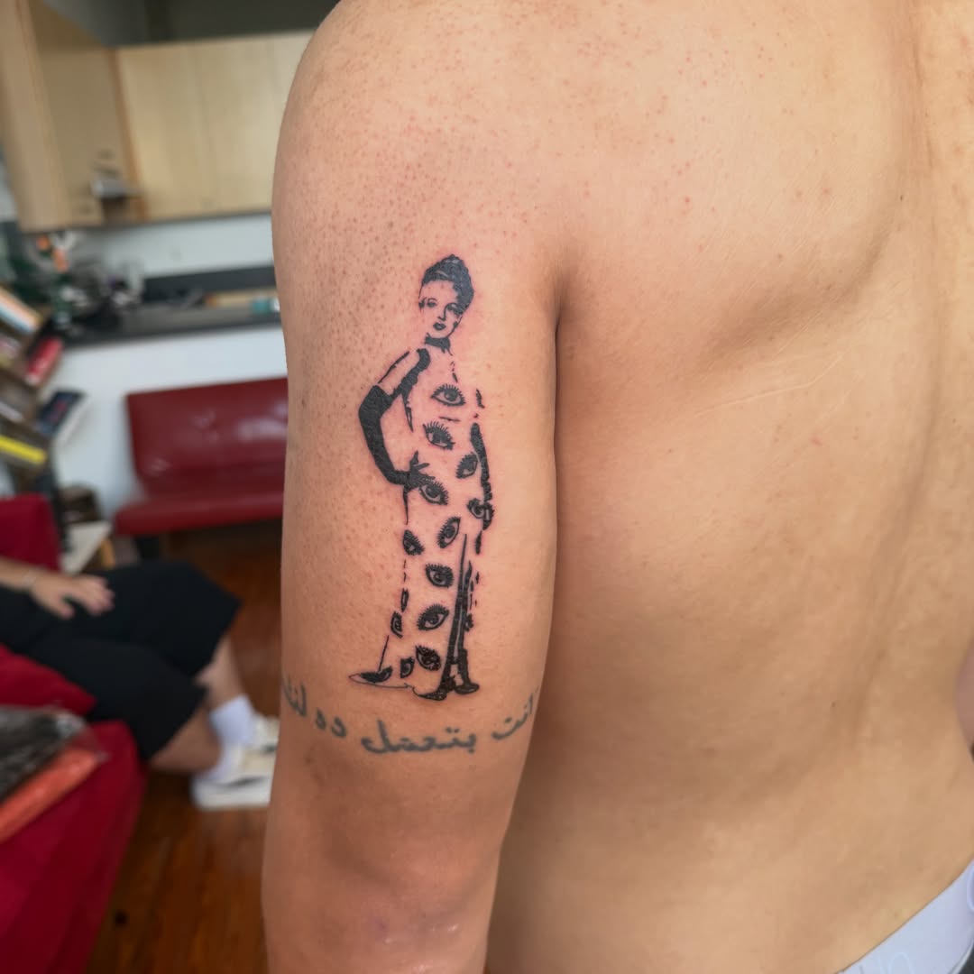 Pregnant woman dotwork tattoo on the upper arm by Jose Javier