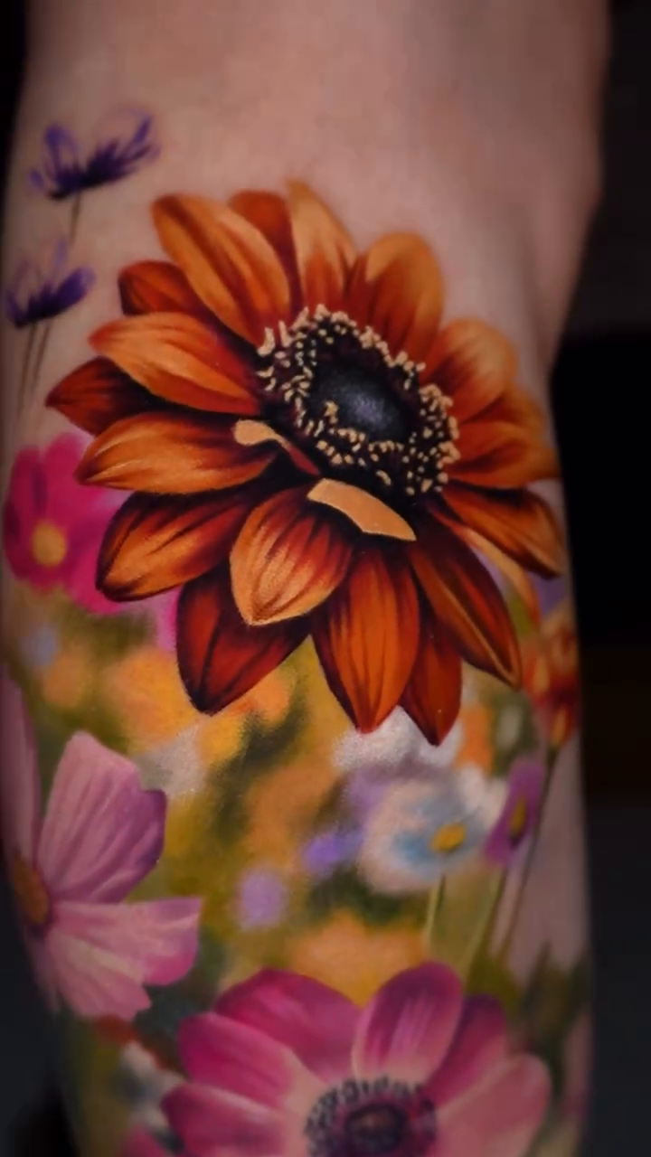 Floral arrangement with a bee realism tattoo by color realism tattoos by gela✨