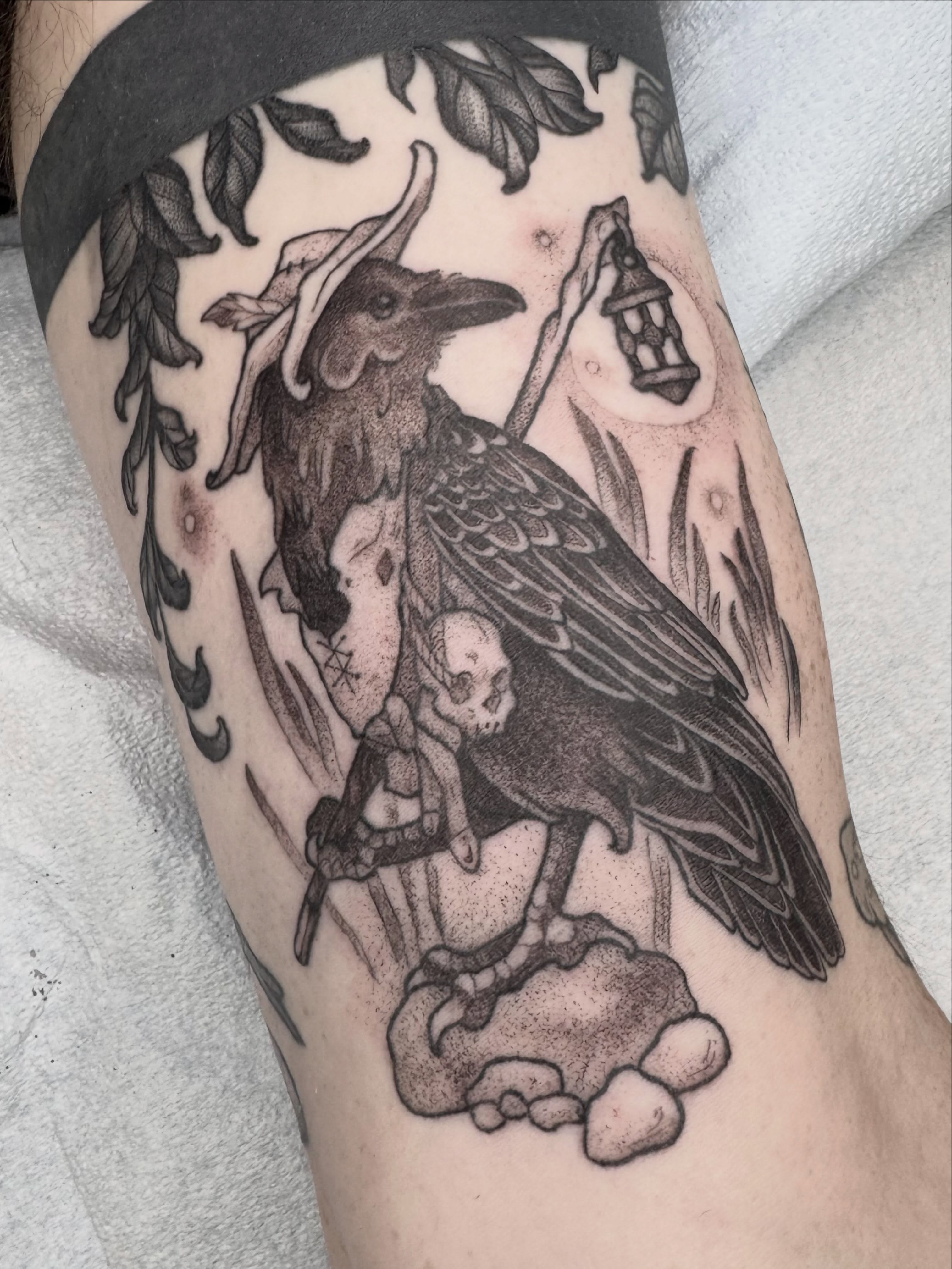 Crow and skull realism tattoo on the forearm by Hillary