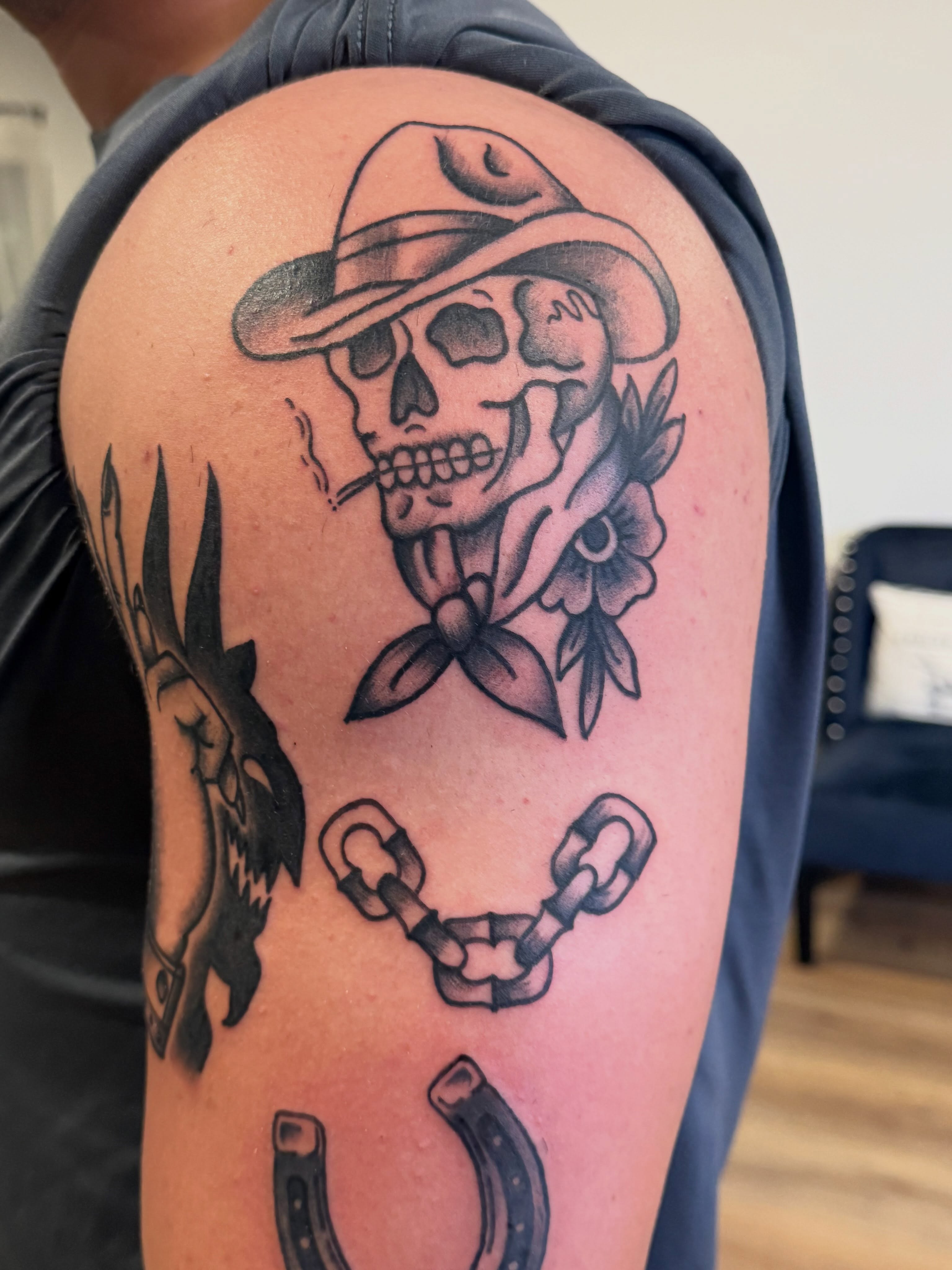Cowboy skull American traditional tattoo on the shoulder by Krystal Harris