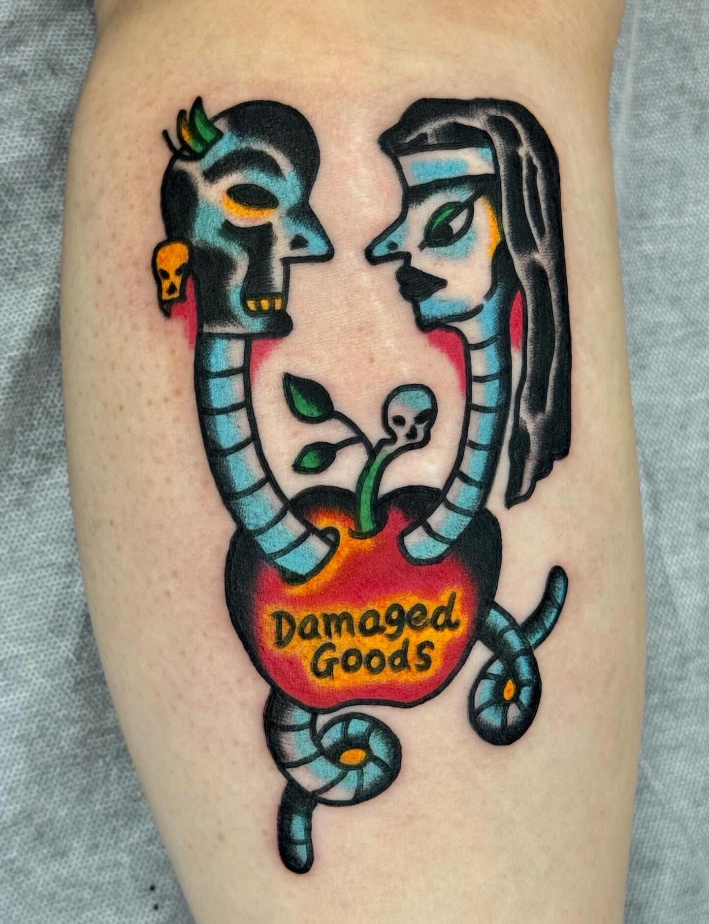 Snake and apple American traditional tattoo on the forearm by JAX