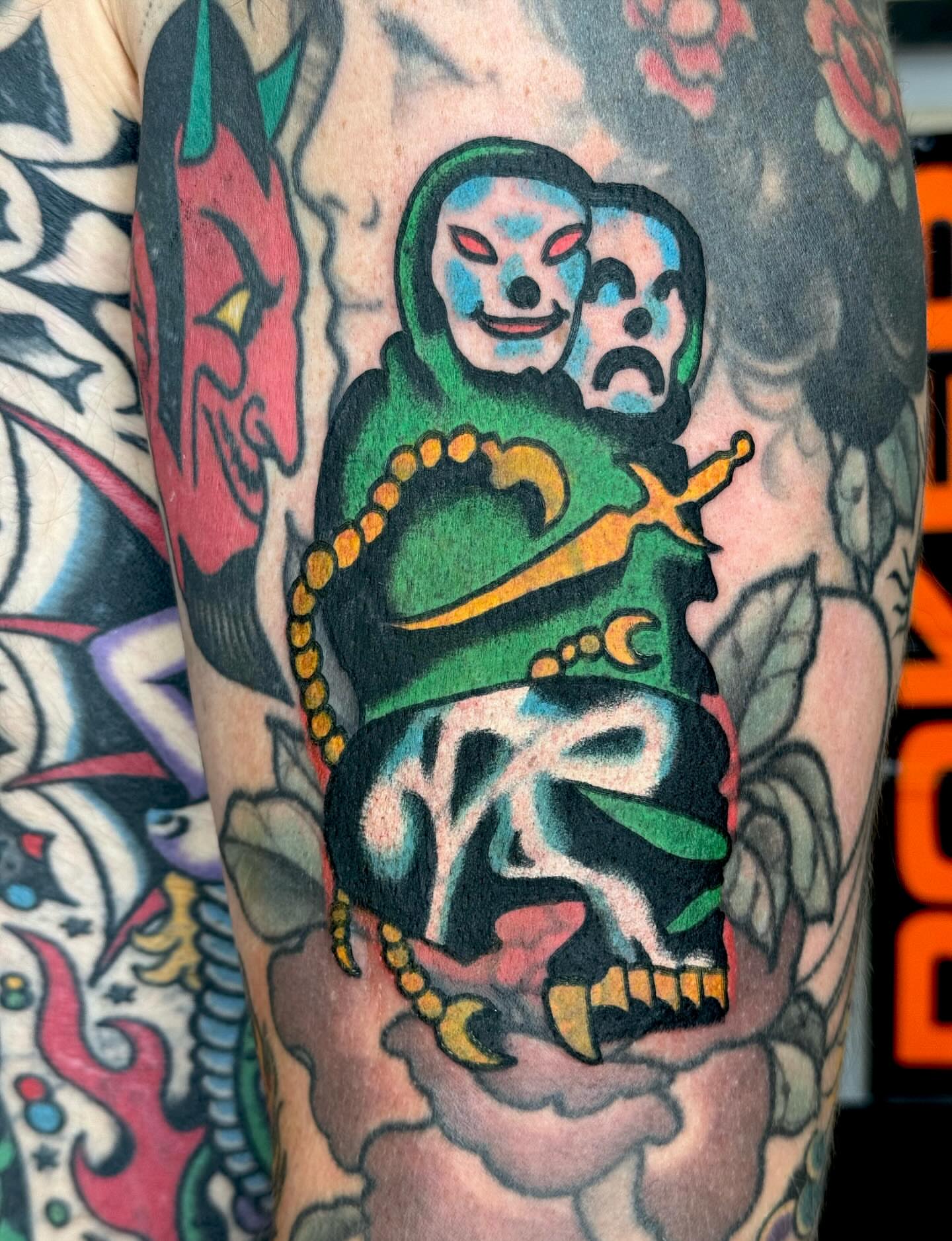 Jester and skull American traditional tattoo on the forearm by JAX