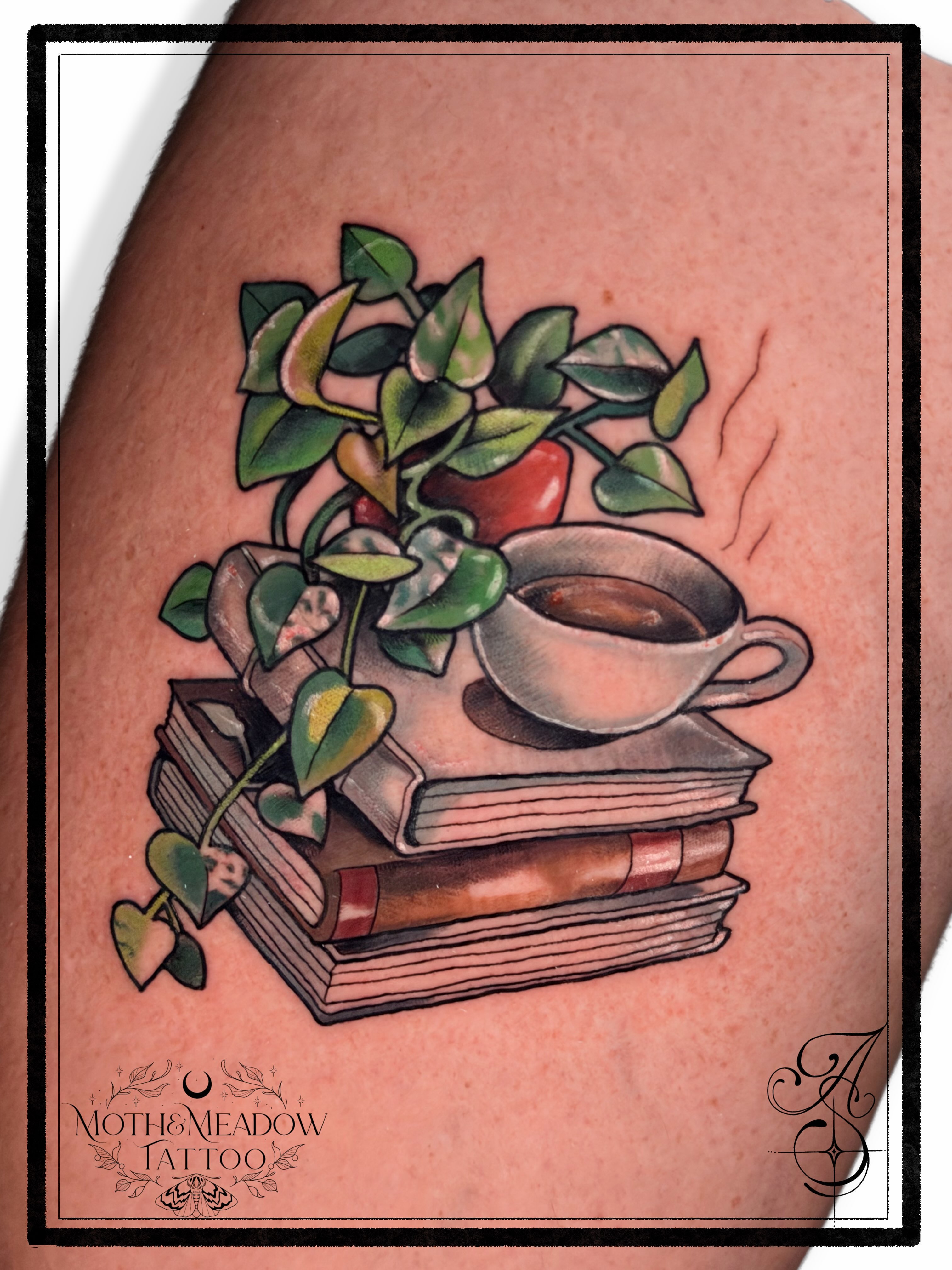 Books and coffee cup American traditional tattoo on the thigh by Ash Sansoucie