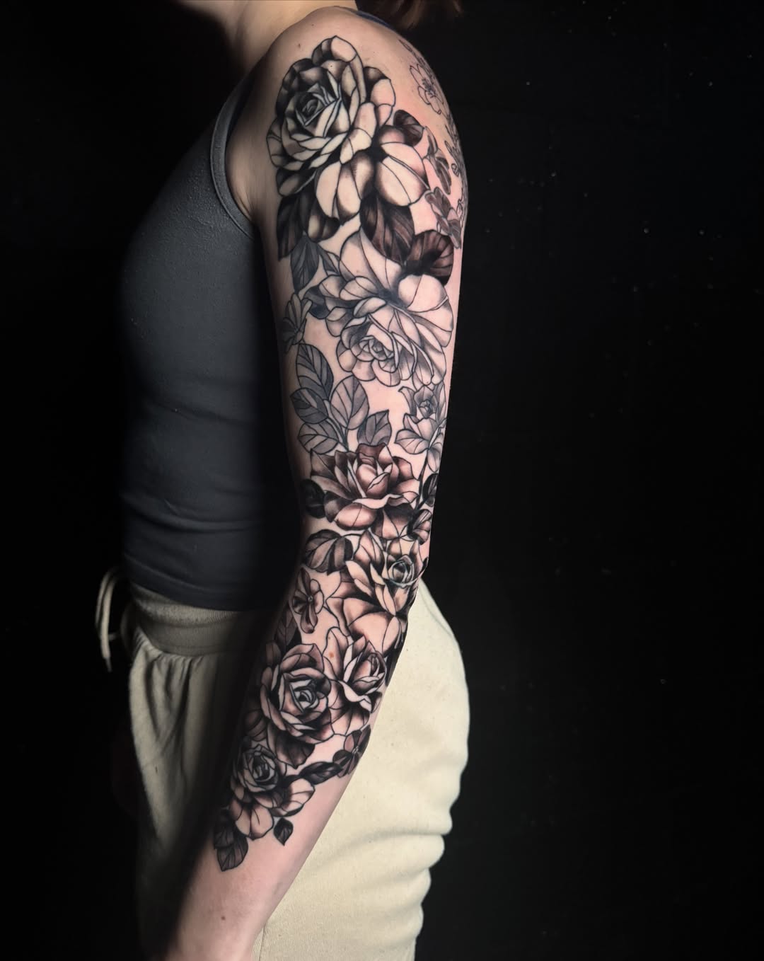 Roses black and grey tattoo on the forearm by Brandiane Wells