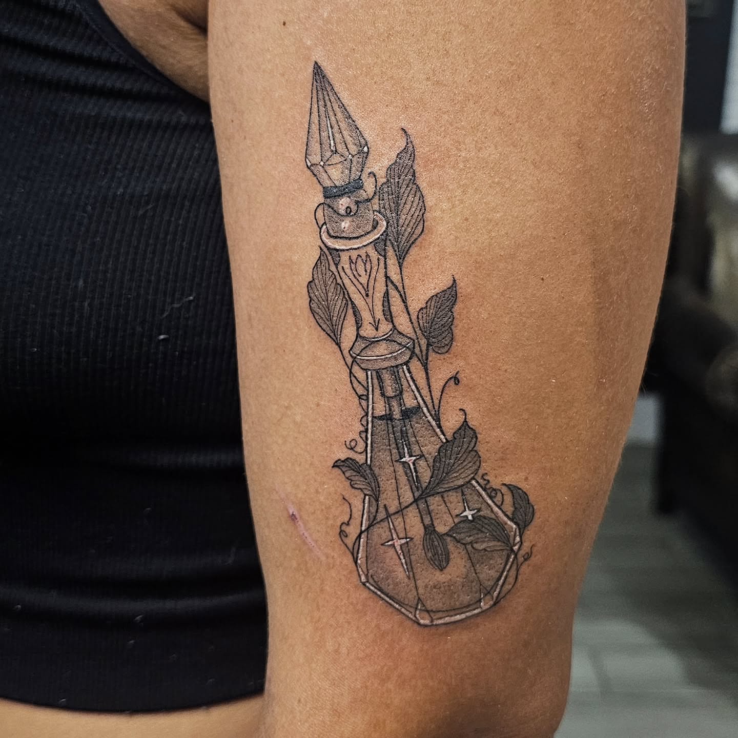 Candle in glass geometric tattoo on the forearm by Casey Jo