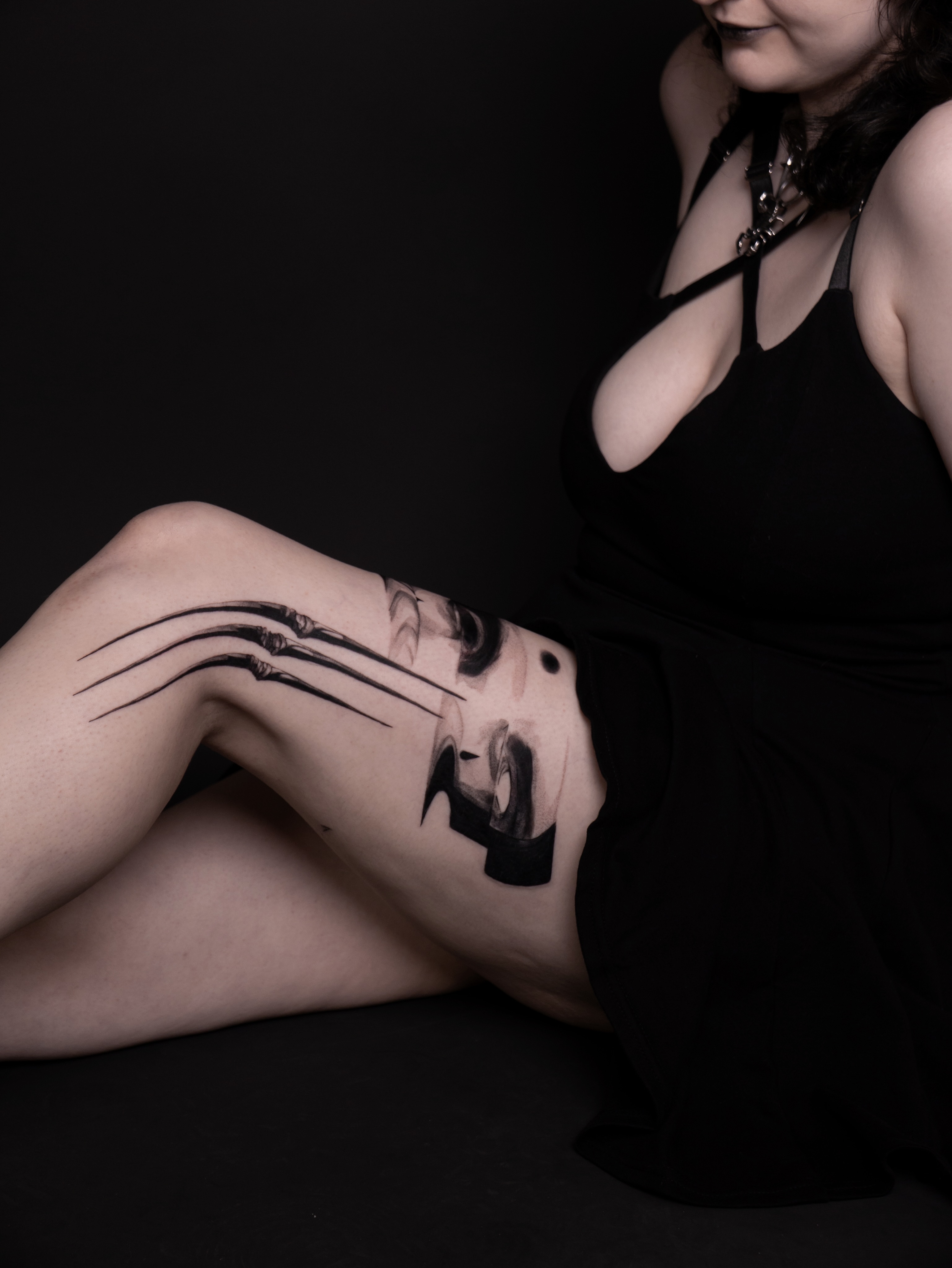 Cat paw black and grey tattoo on the thigh by Mané, Portland, Oregon