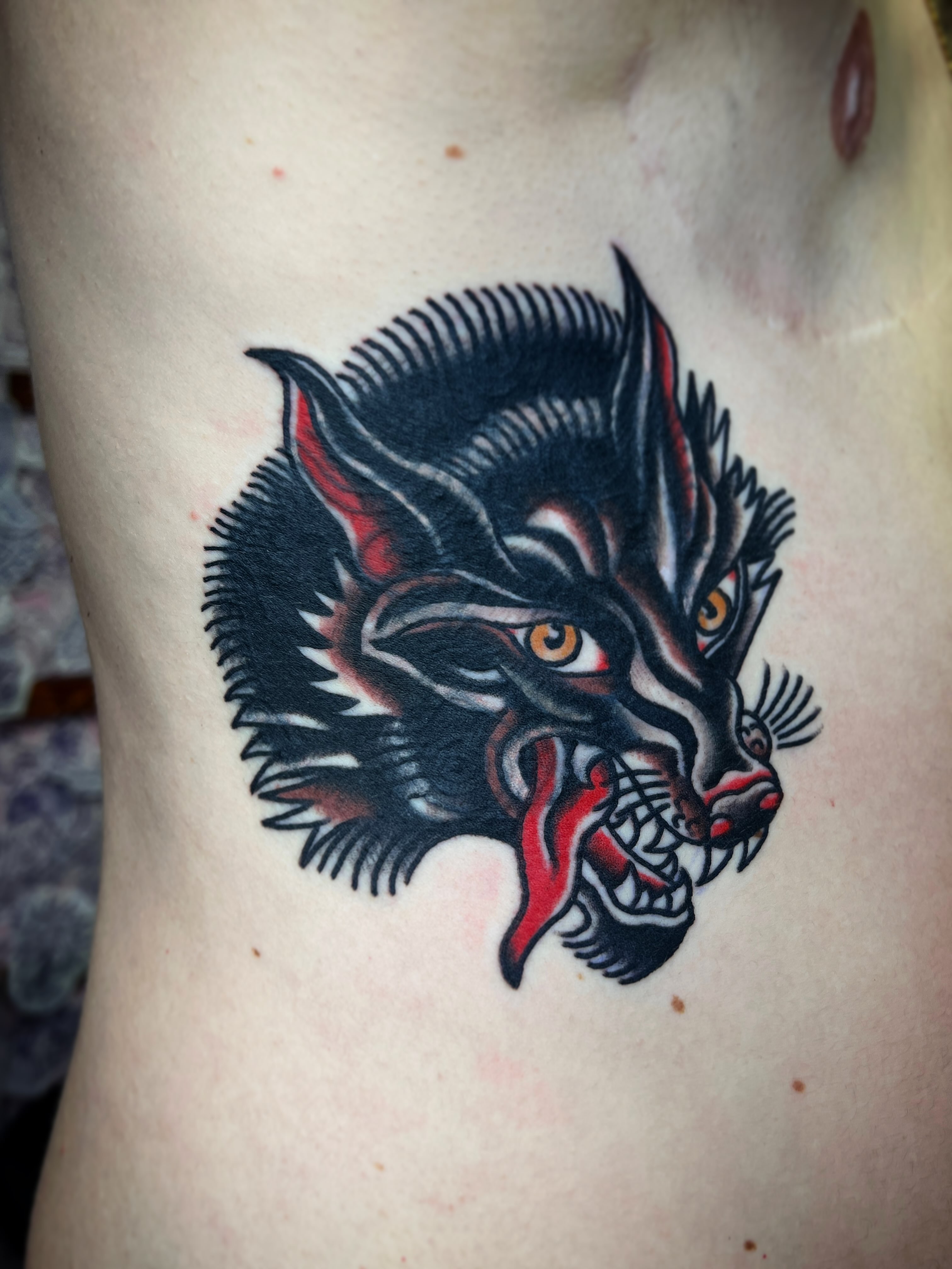 Demon head American traditional tattoo on the ribs by Leo 🌞 Pdx Tattoo