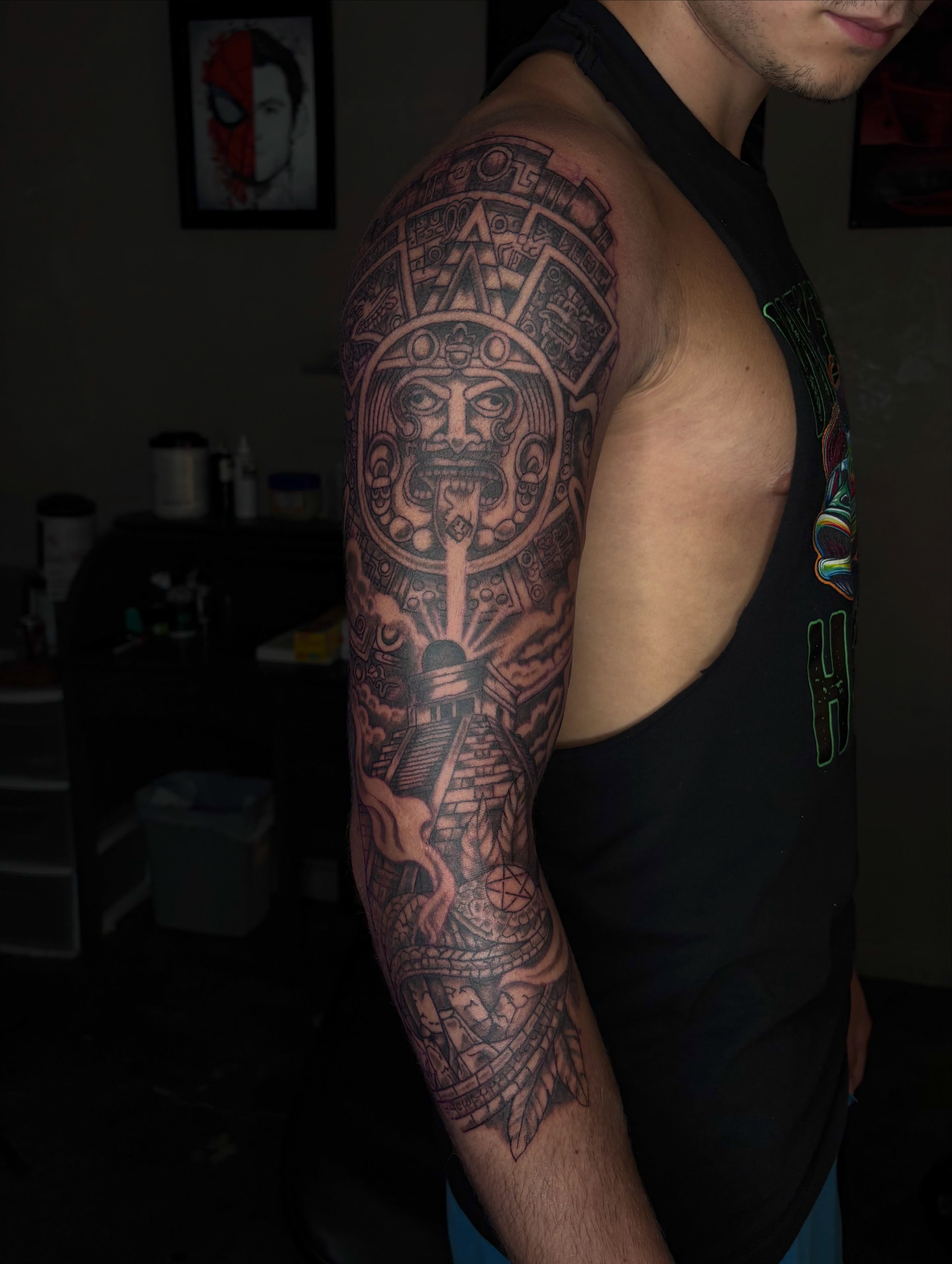 Ancient deity geometric tattoo on the upper arm by Evan Chastain