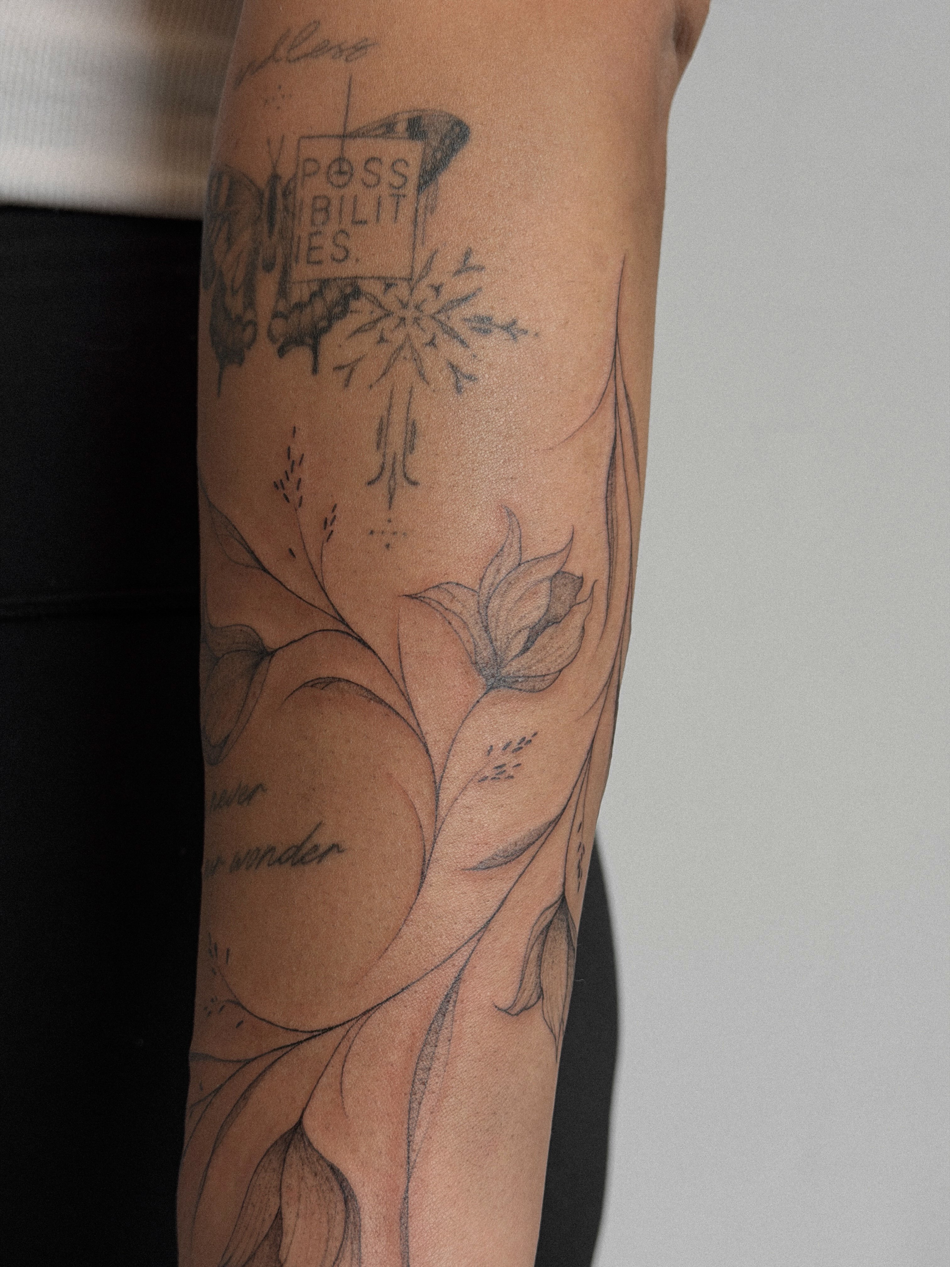 Botanical realism tattoo on the forearm by Hannah Matthews