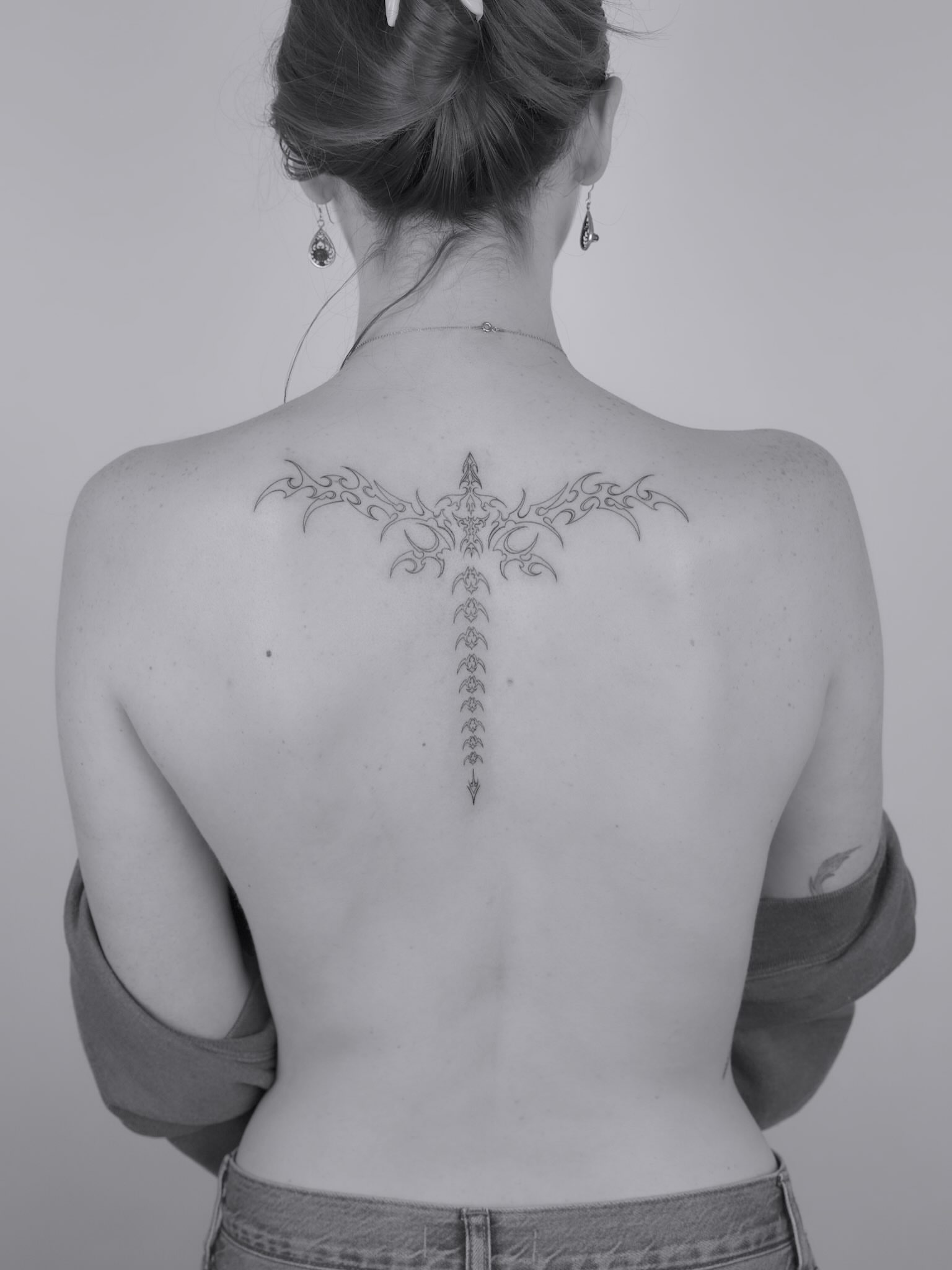 Tribal cross tribal tattoo on the back by Julia