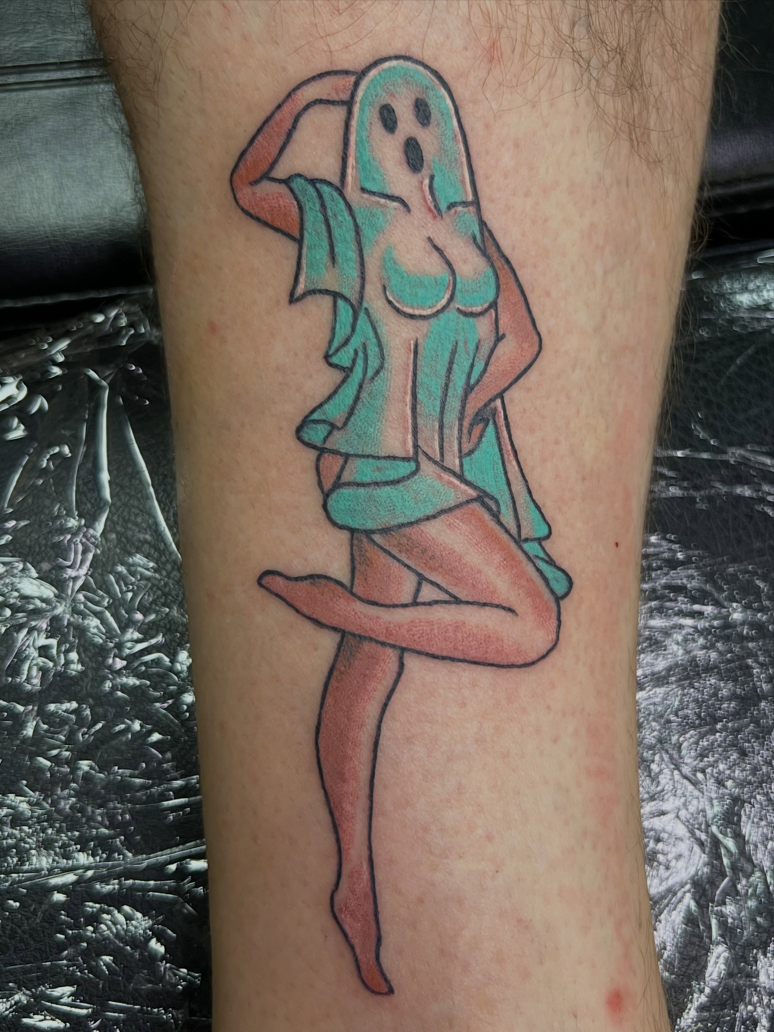 Ghostly pin-up girl new school tattoo on the forearm by Christopher Anderson-arnesen