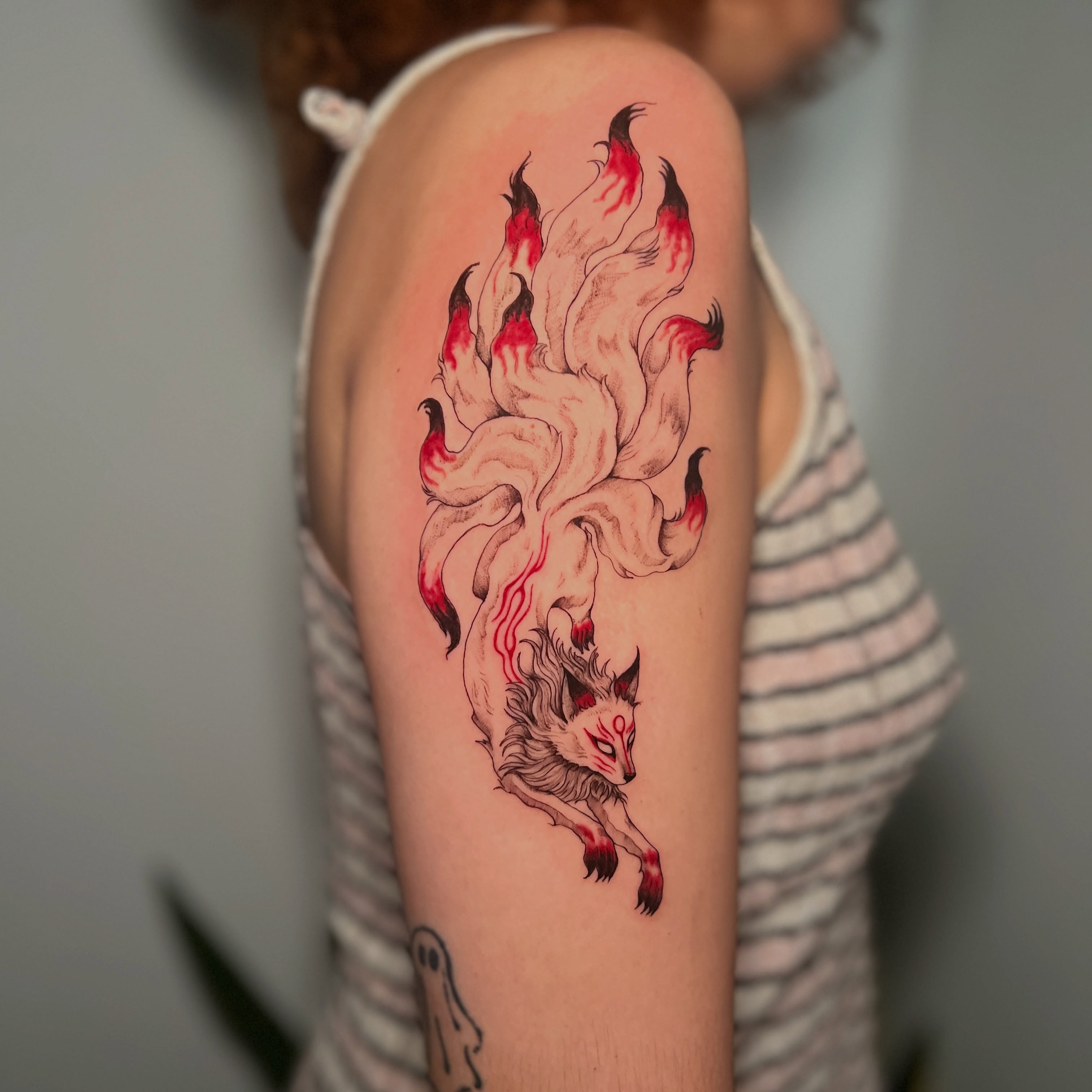 Fox dotwork tattoo on the upper arm by Eleana, North Miami, Florida
