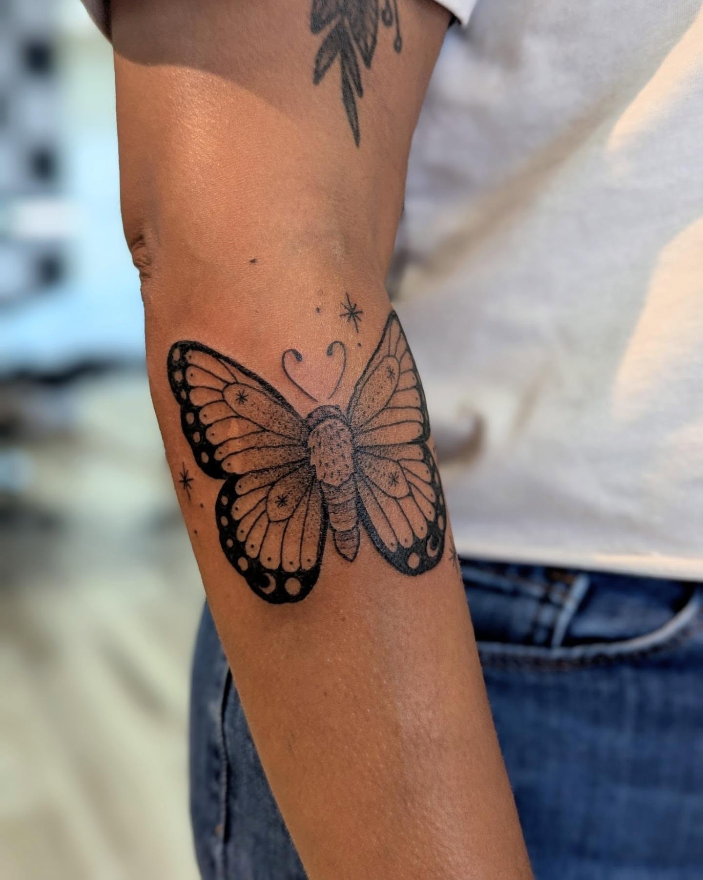 Butterfly dotwork tattoo on the forearm by Dani Harkey