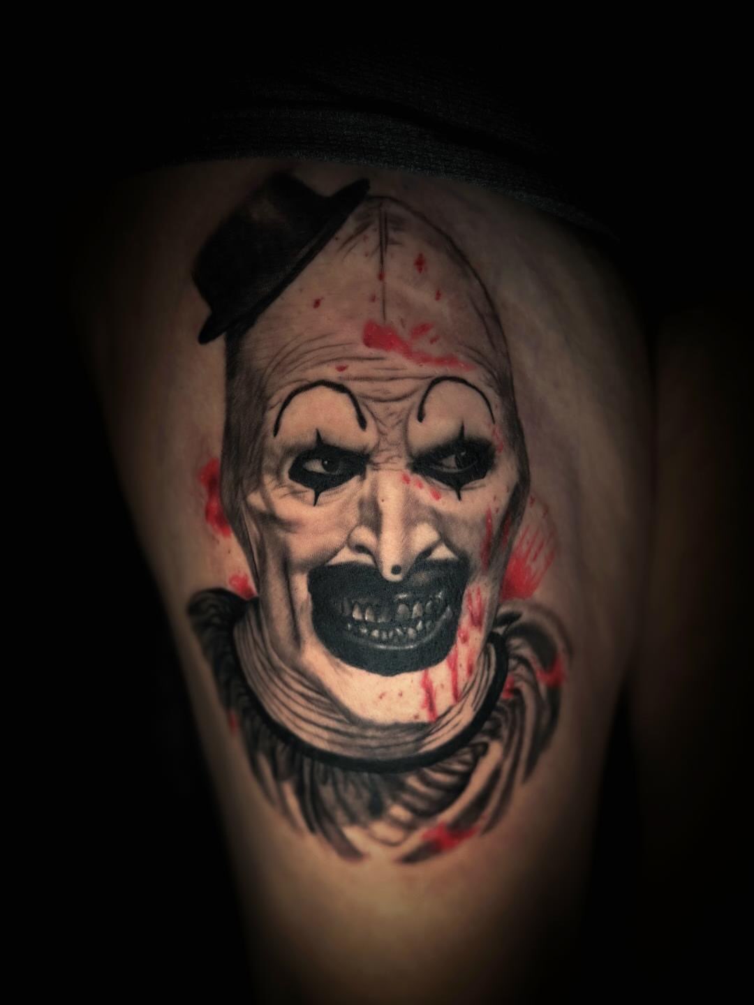 Clown realism tattoo on the thigh by John Christo Blake