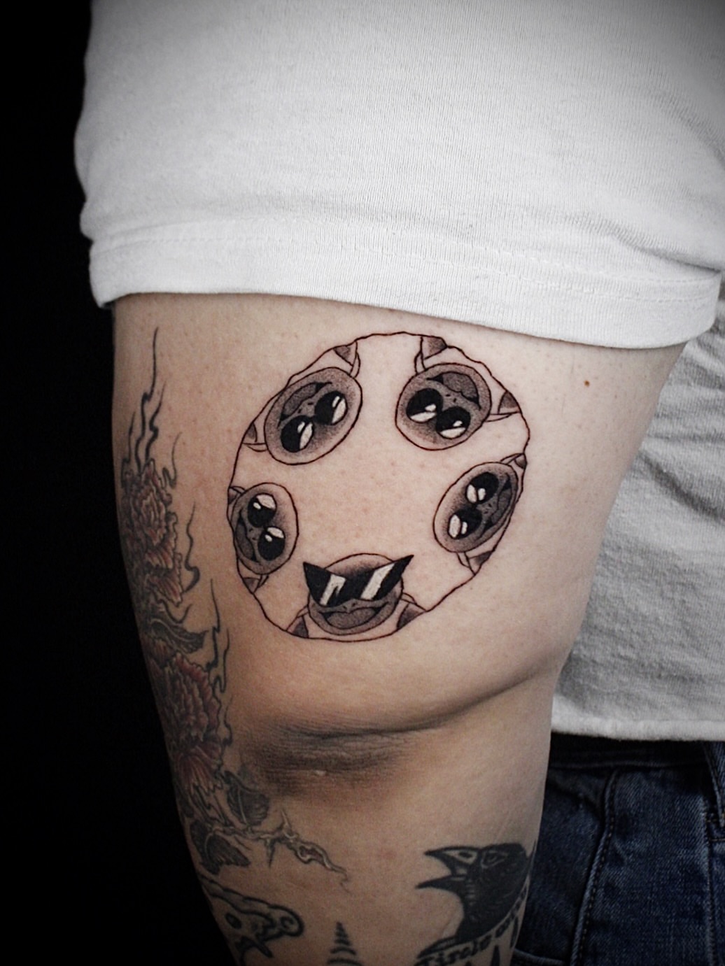 Eyes black and grey tattoo on the thigh by Kanya, Alhambra, California