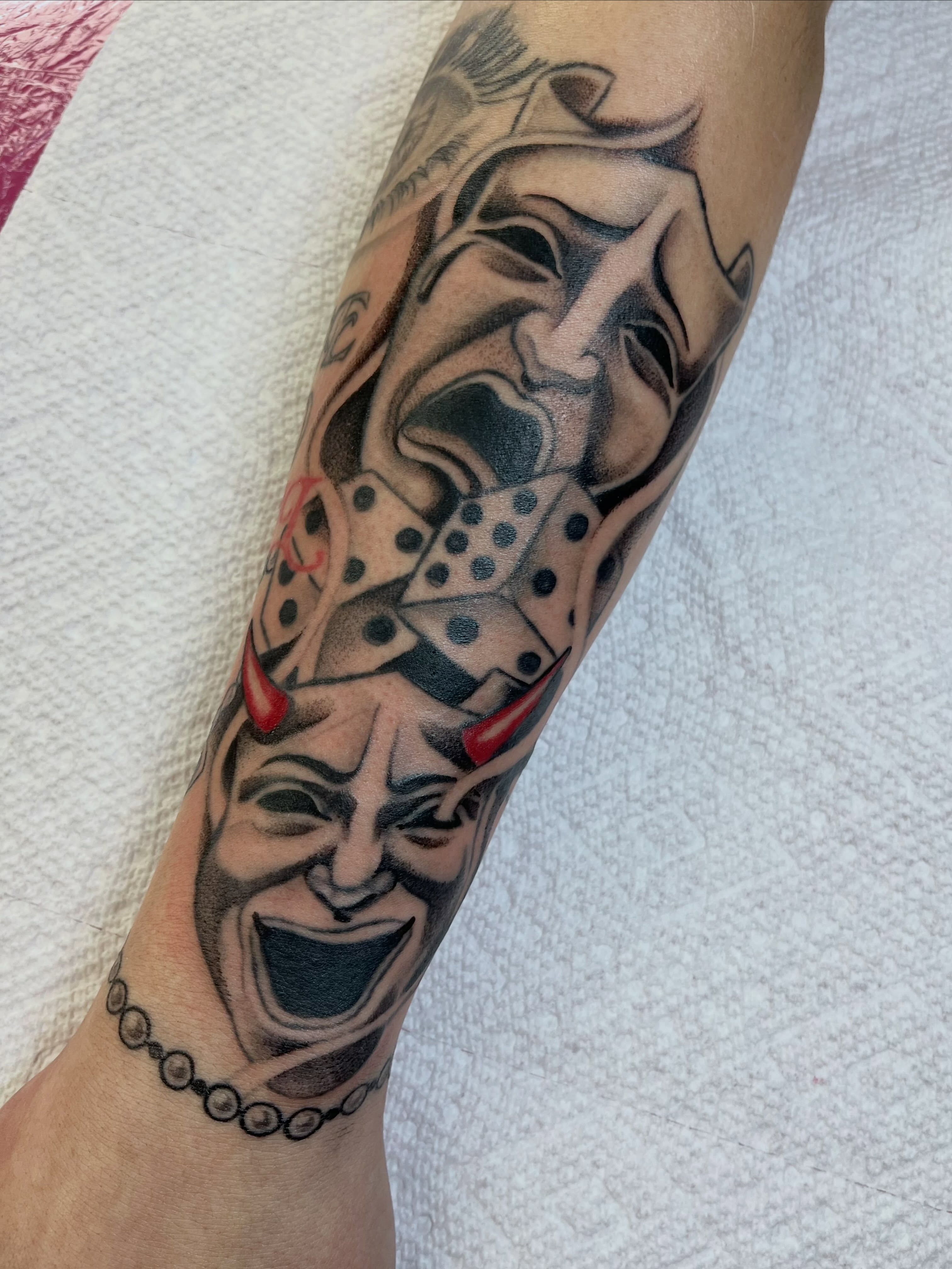 Clown masks realism tattoo on the forearm by ᴴᴬᴺᴺᴬᴴ ᴿᵁᴰᴰᴱᴸᴸ