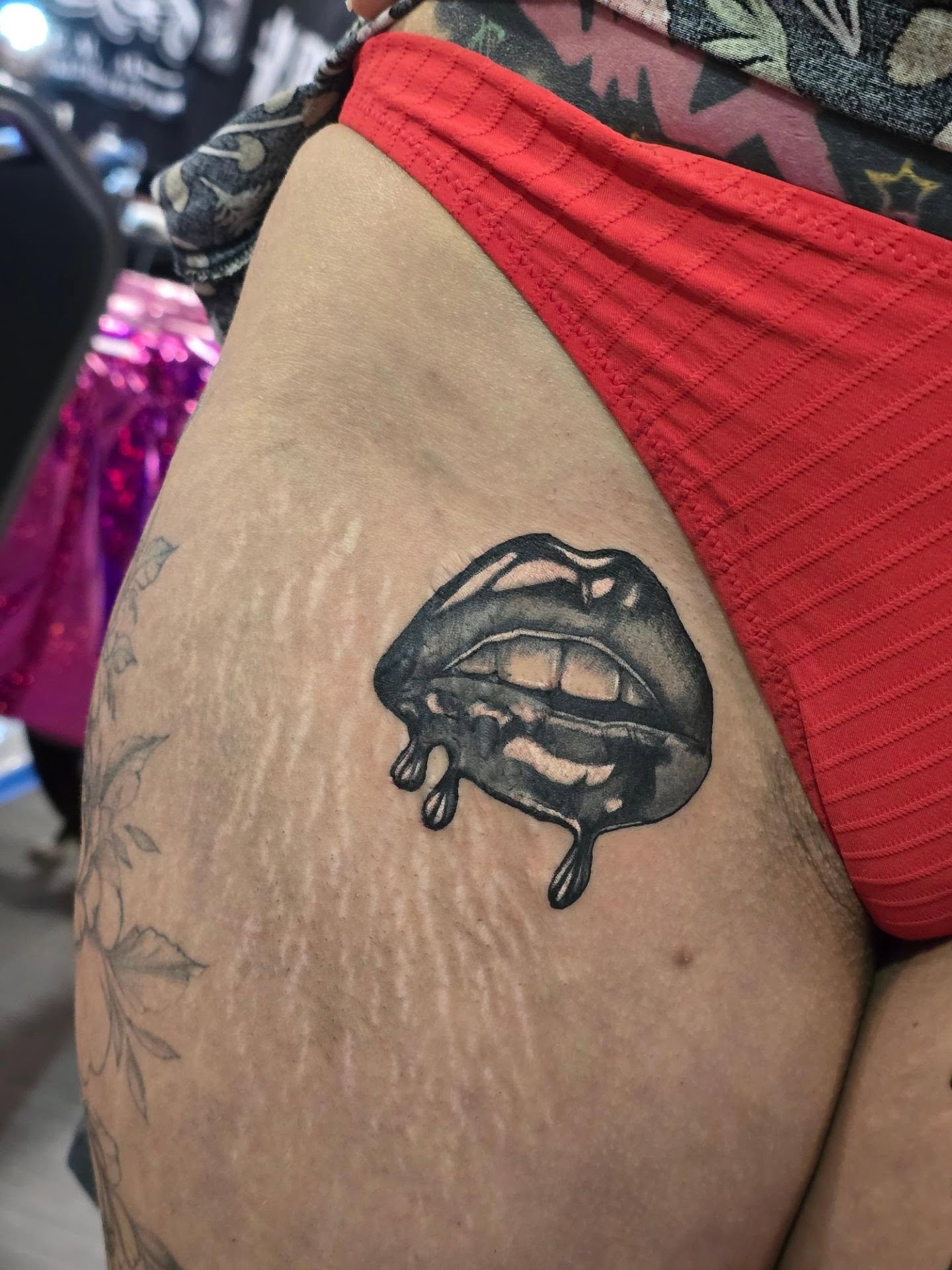 Melting lips realism tattoo on the thigh by Rachel, Centereach, New York