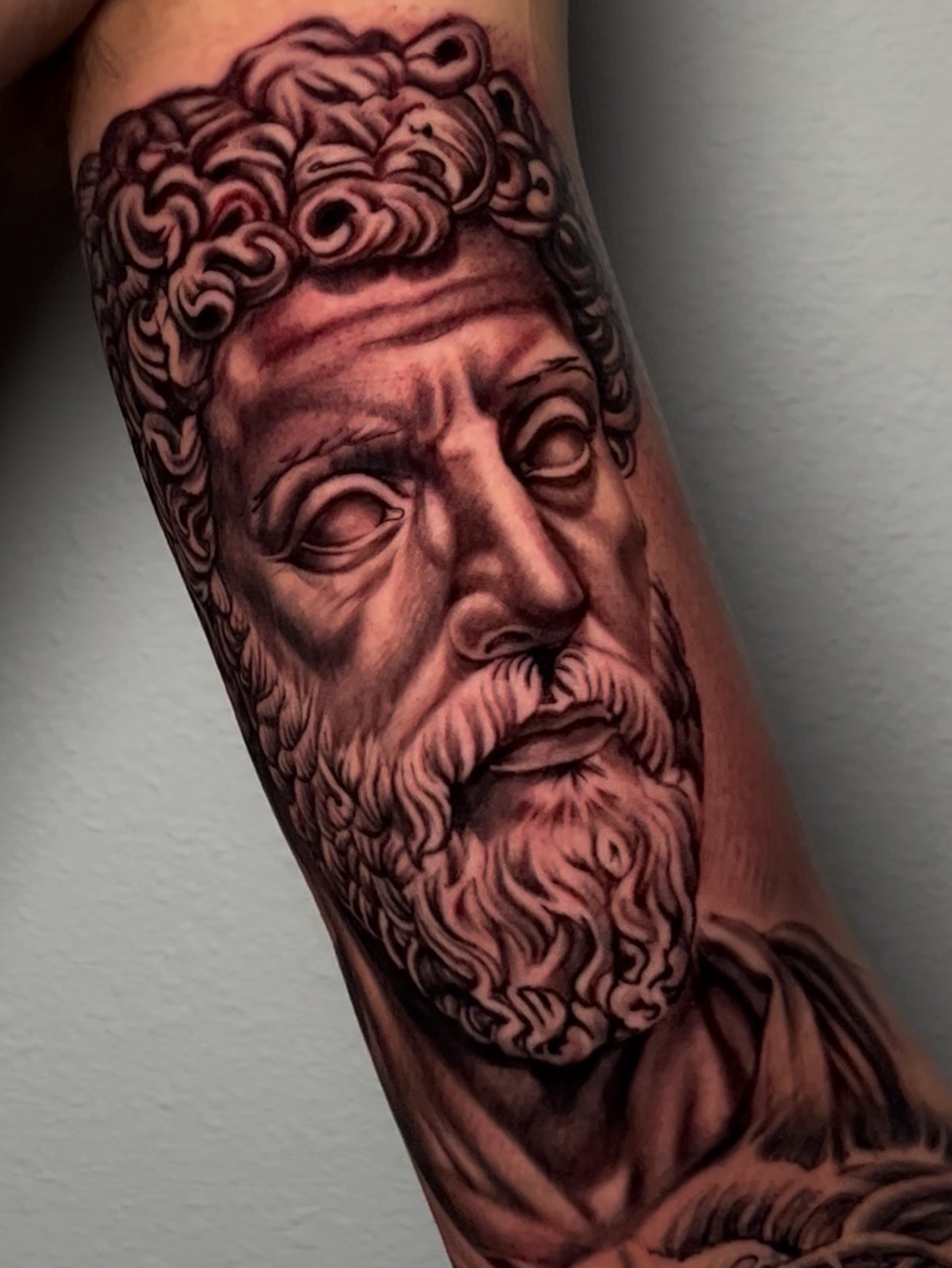 Ancient philosopher realism tattoo on the forearm by Dave