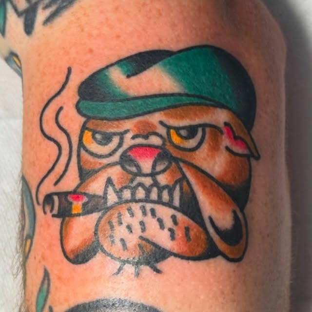 Bulldog smoking cigarette American traditional tattoo on the forearm by Rob White