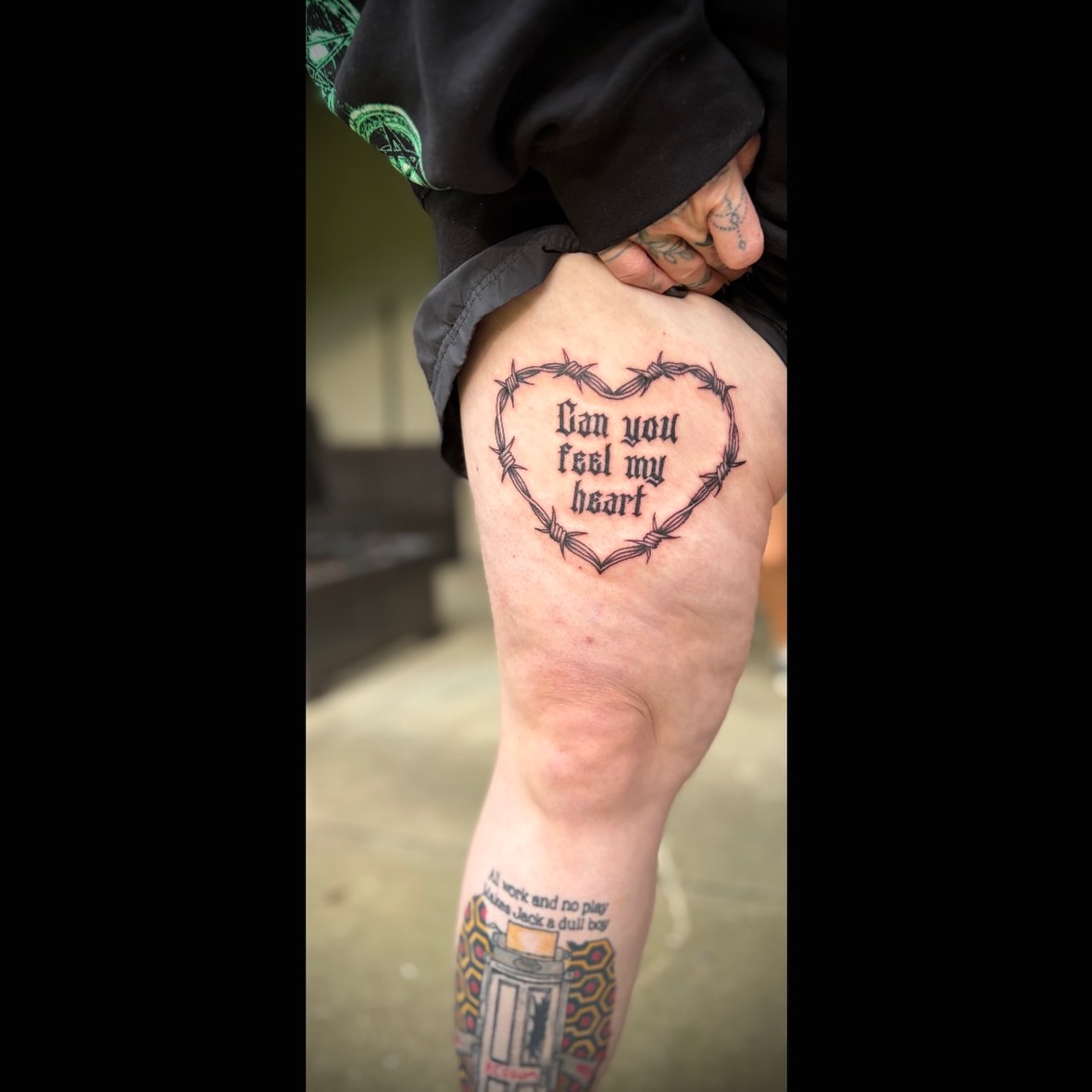 Barbed wire heart black and grey tattoo on the thigh by Kiersten Tickle