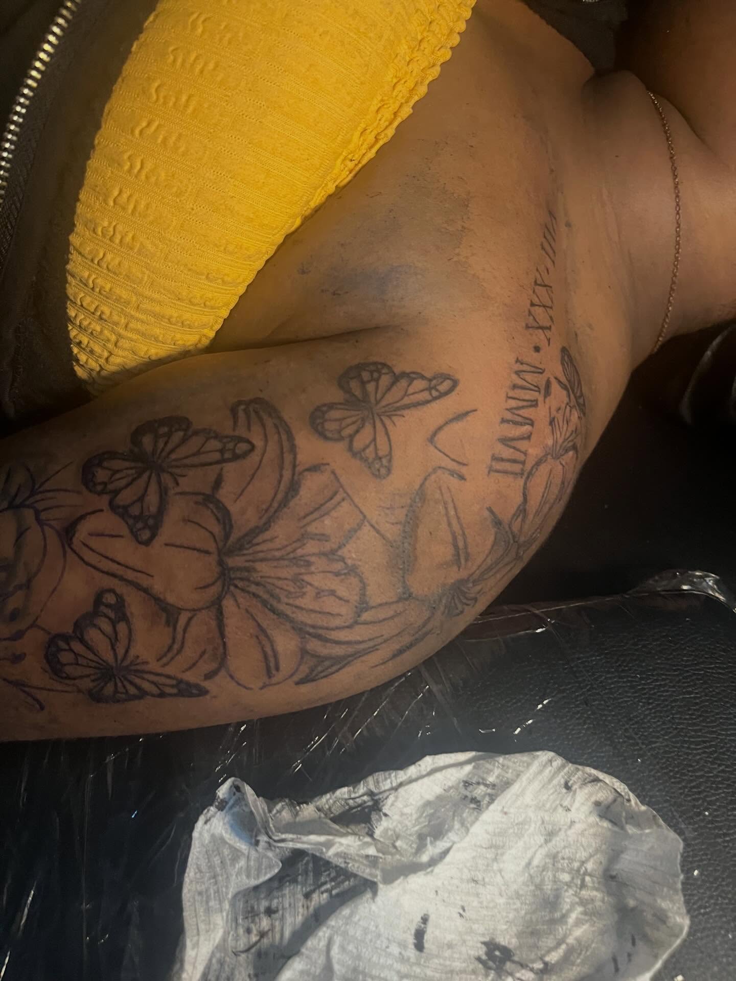 Butterflies and flowers black and grey tattoo on the upper arm by π Westside