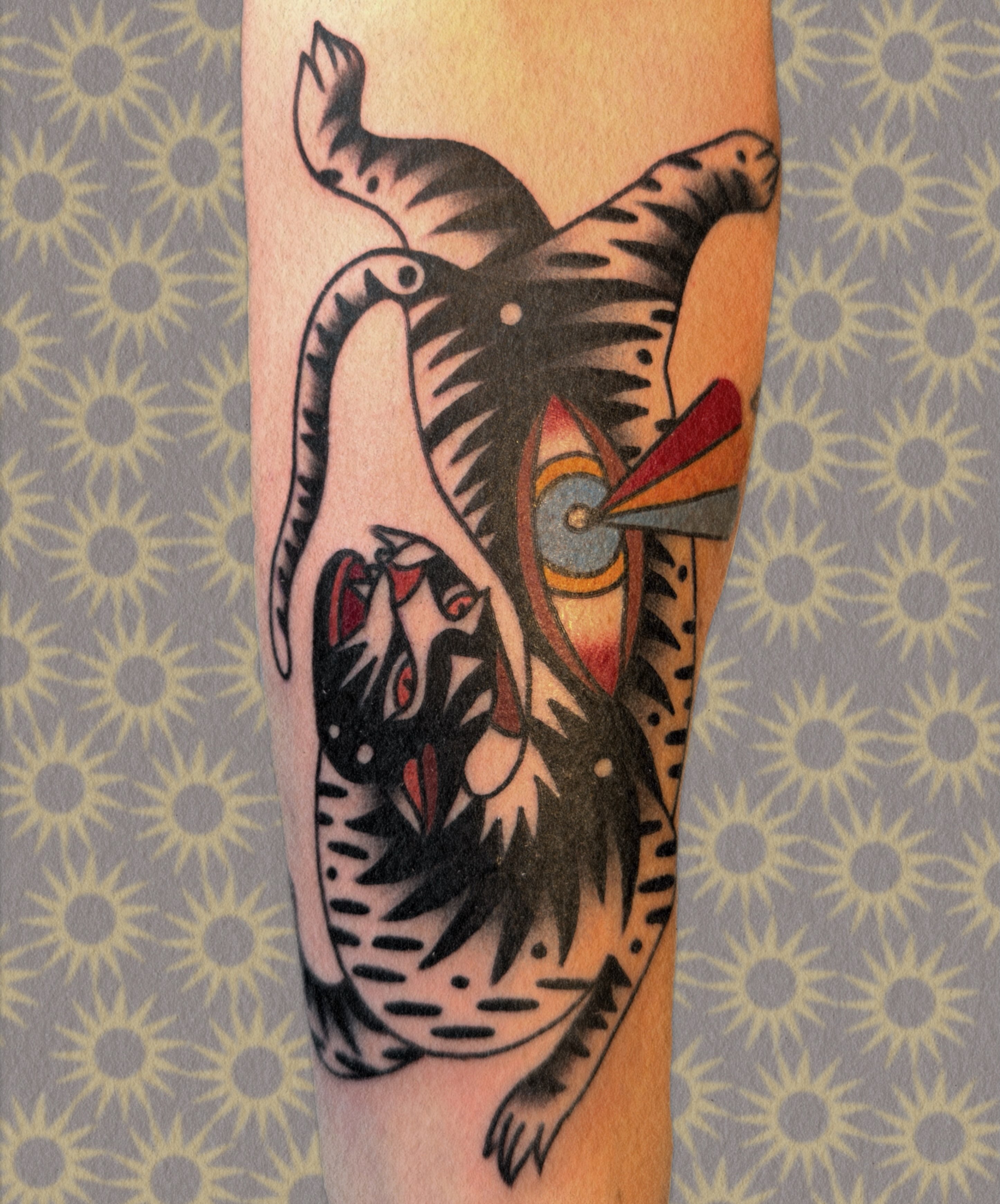 Tiger American traditional tattoo on the forearm by Manee Friday