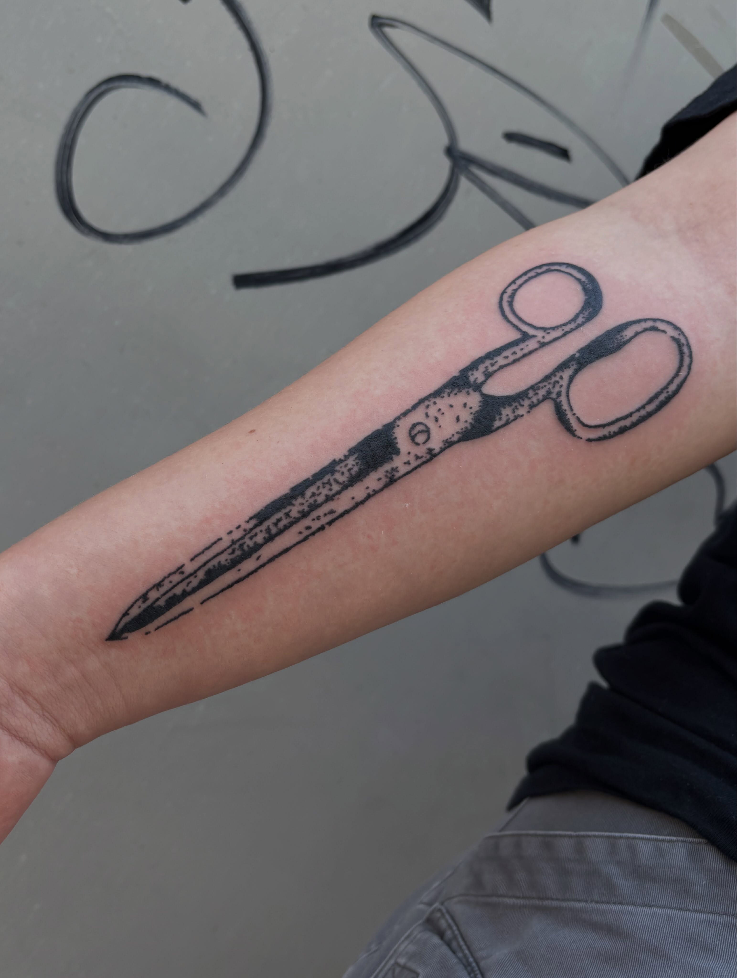 Scissors black and grey tattoo on the forearm by Turner
