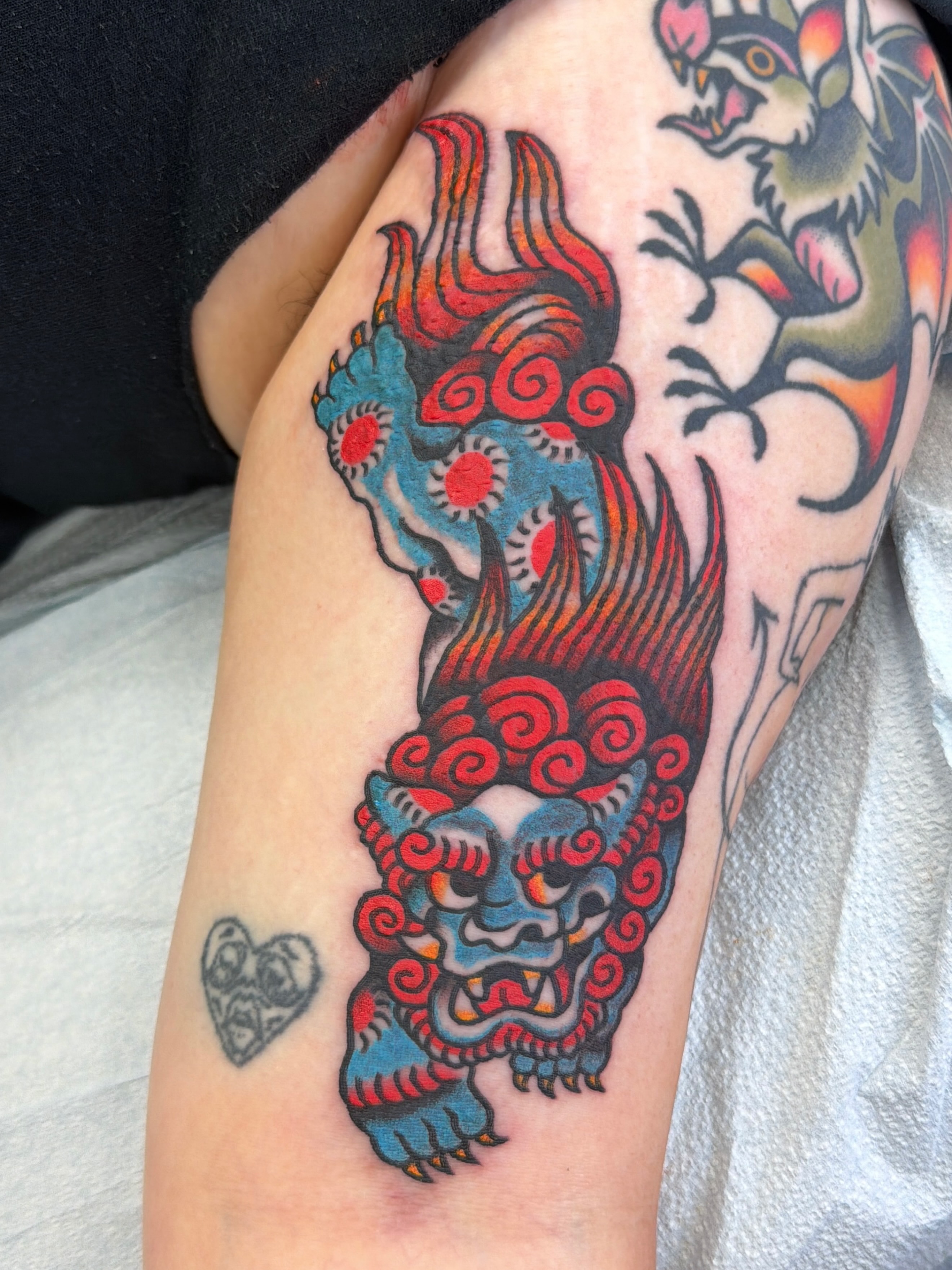 Lion American traditional tattoo on the forearm by Emma Fox Tattoo