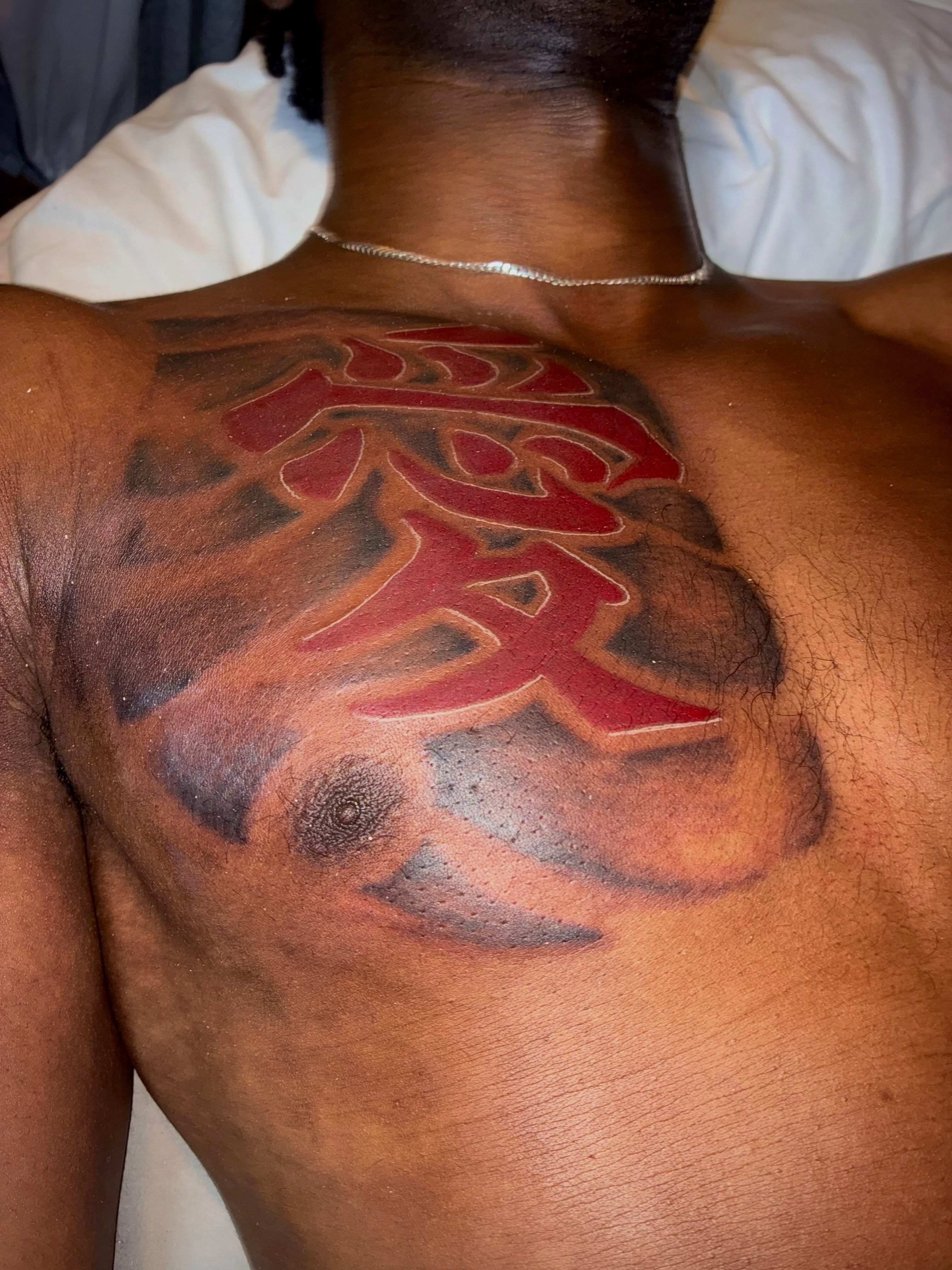 Kanji character black and grey tattoo on the back by Sonya son tattoos and piercings