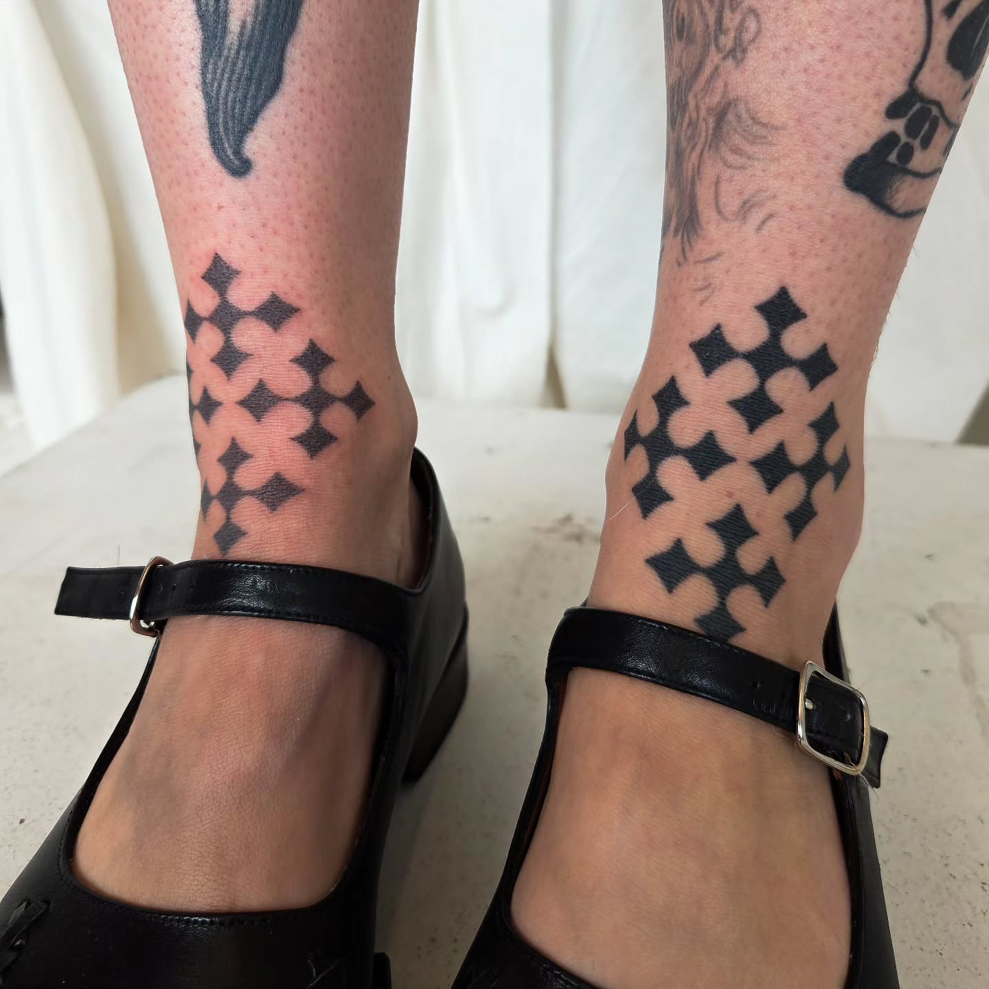 Crosses geometric tattoo on the calf by jules tattoos