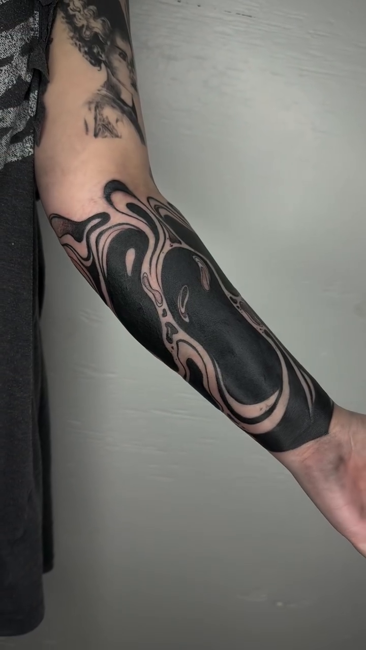 Abstract flowing shapes blackwork tattoo by Bradi