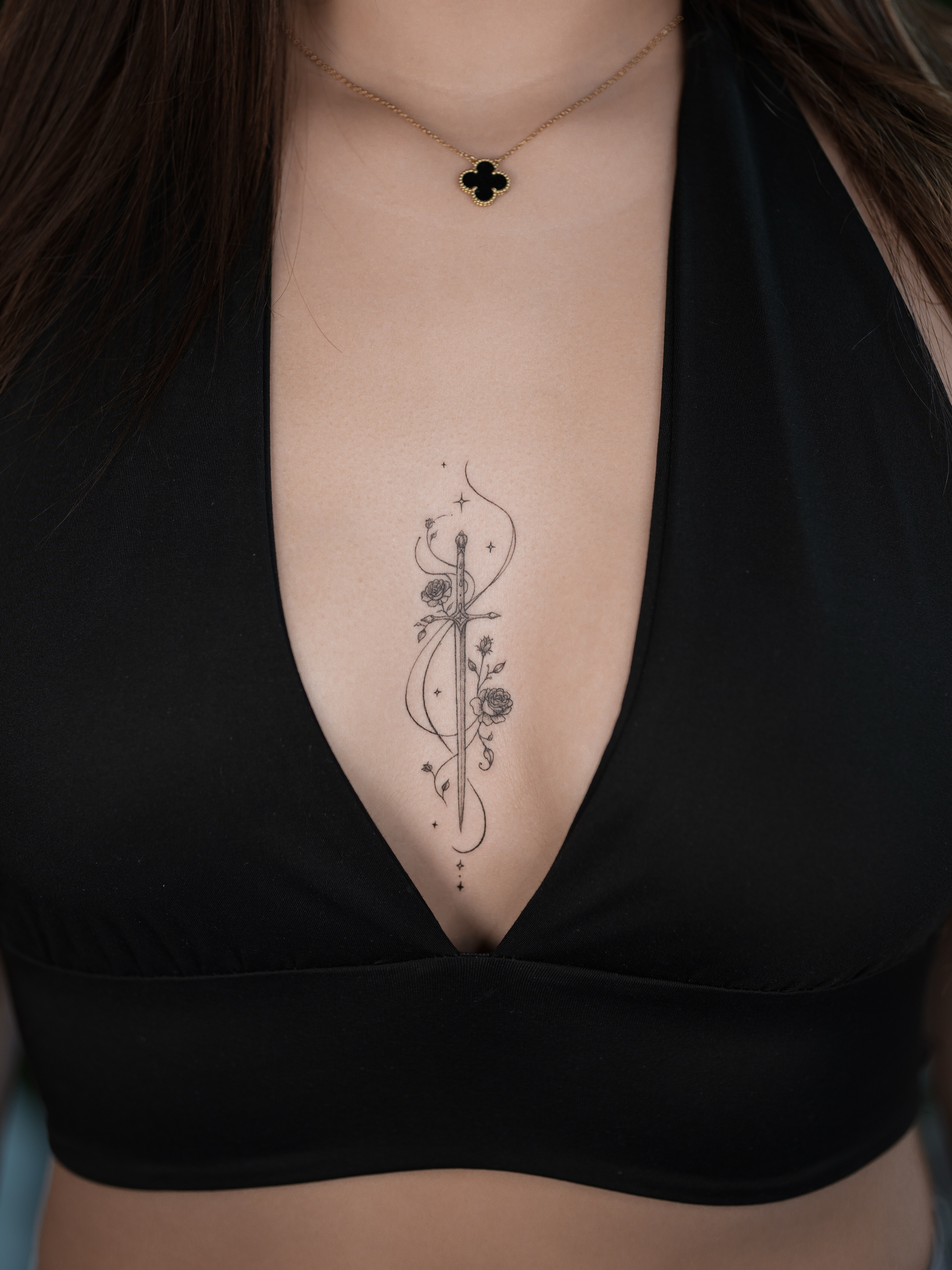 Sword and roses black and grey tattoo on the chest by Jena