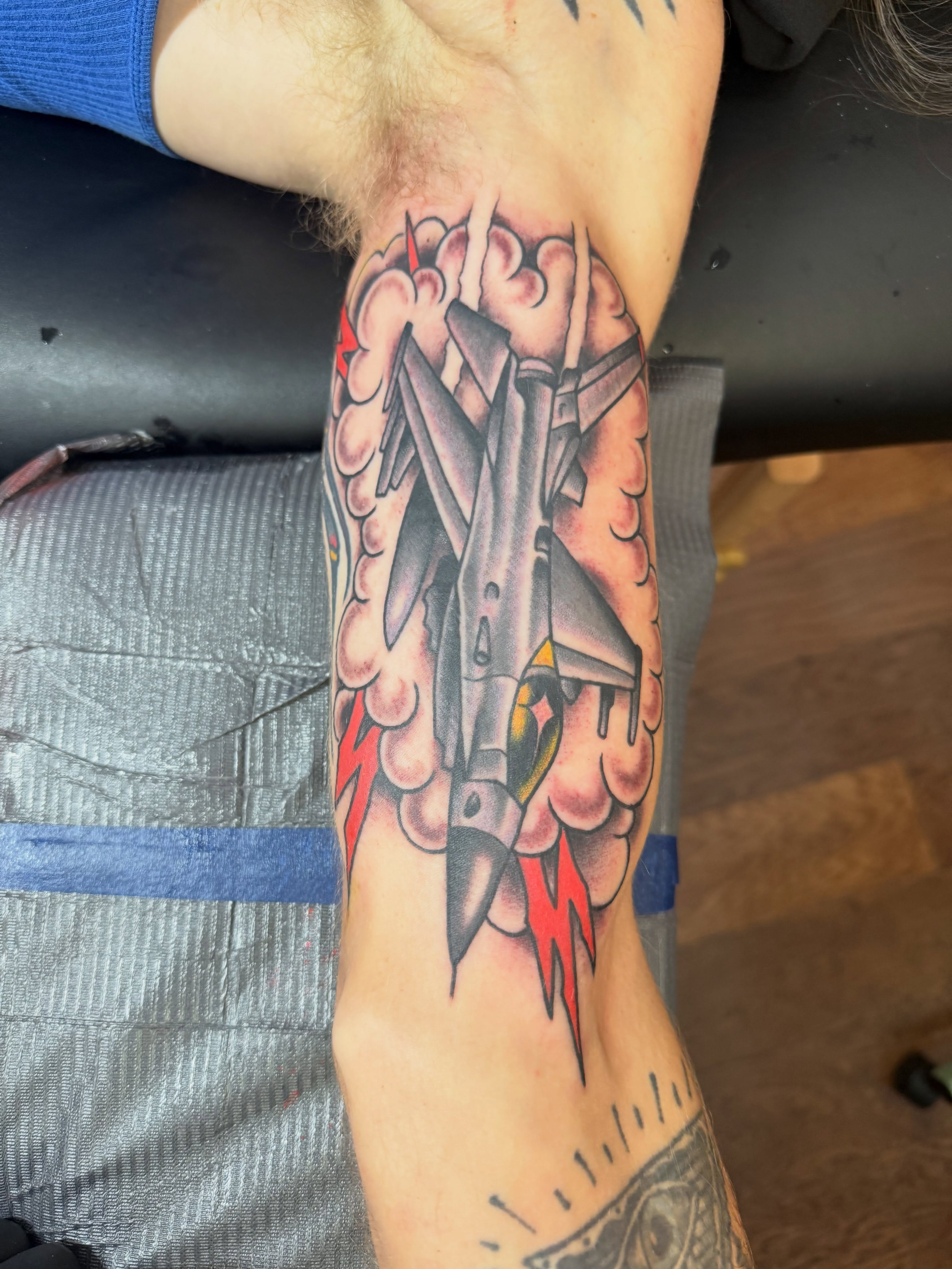 Airplane American traditional tattoo on the forearm by Cody Dalton