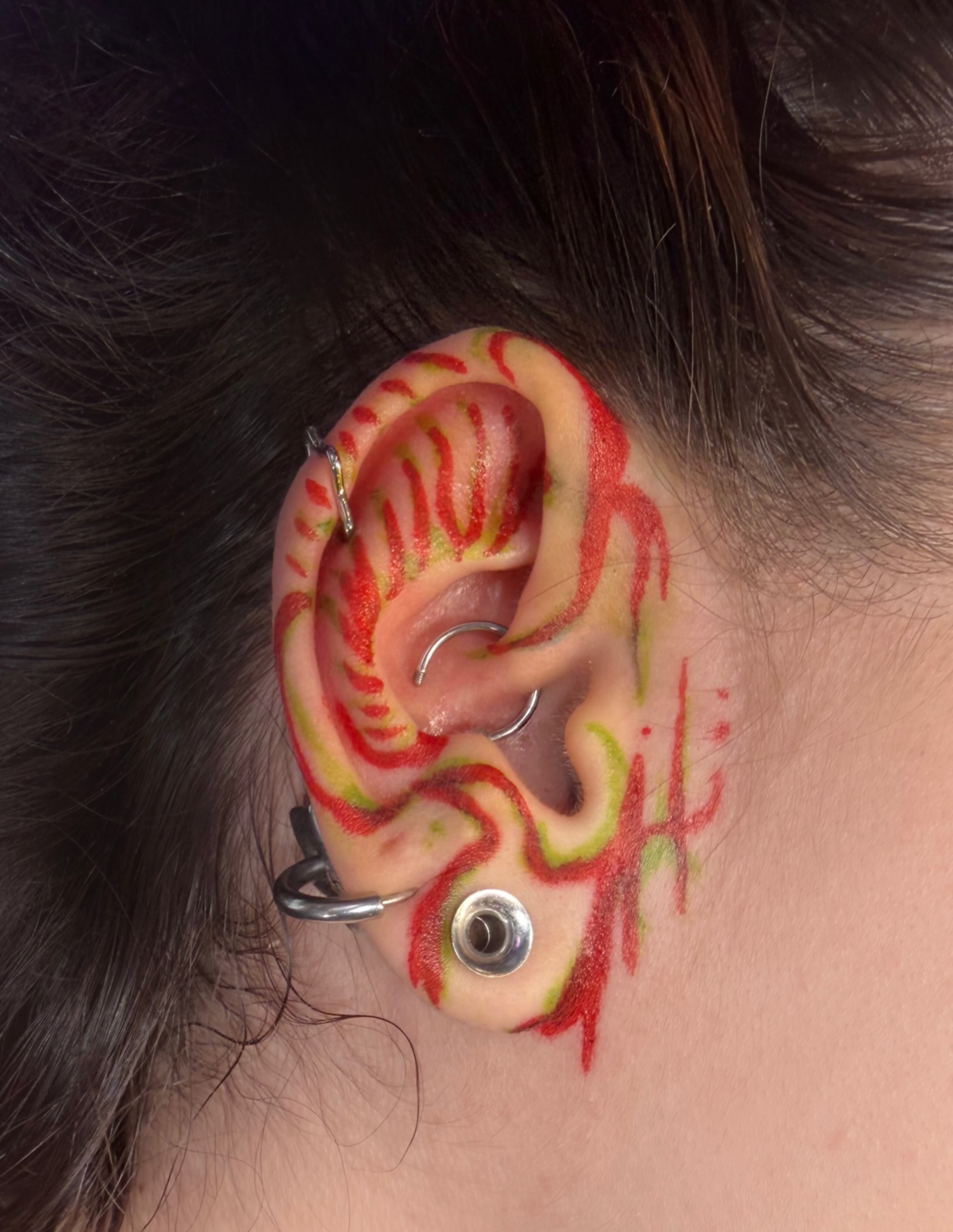 Ear with intricate design dotwork tattoo by Justina🪐