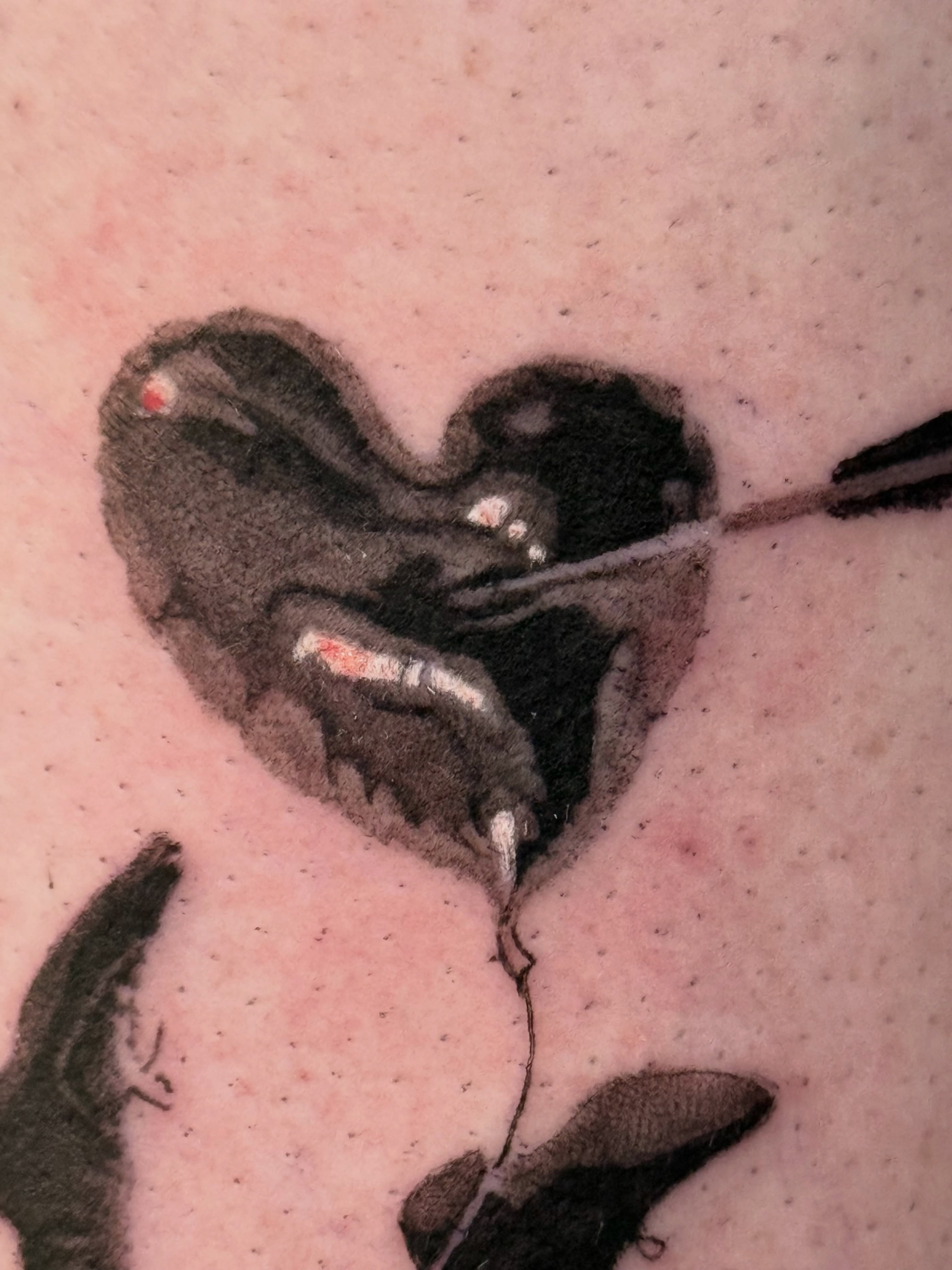 Heart with arrow black and grey tattoo on the upper arm by Joel: Boston Tattoo Artist, Boston, Massachusetts