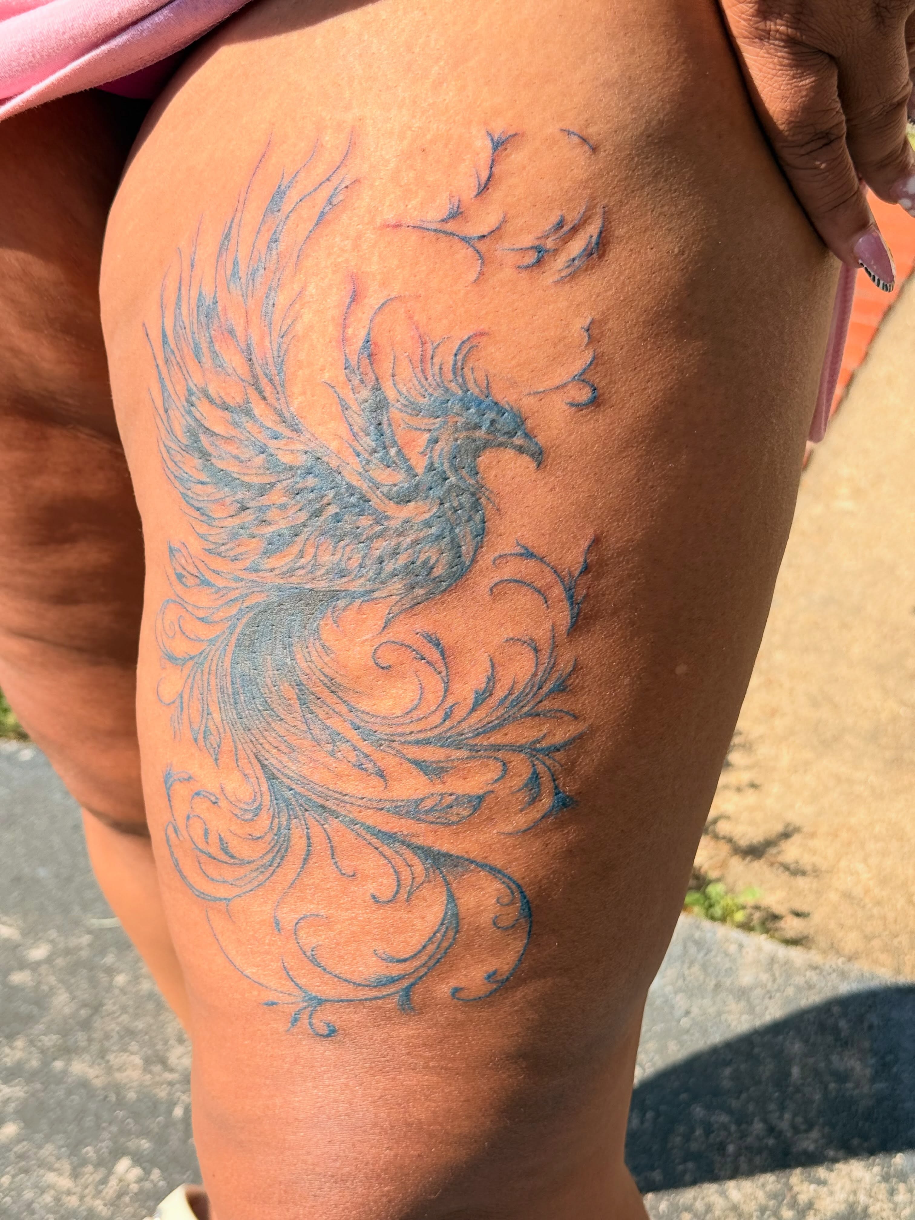 Phoenix new school tattoo on the thigh by Jazz Walker
