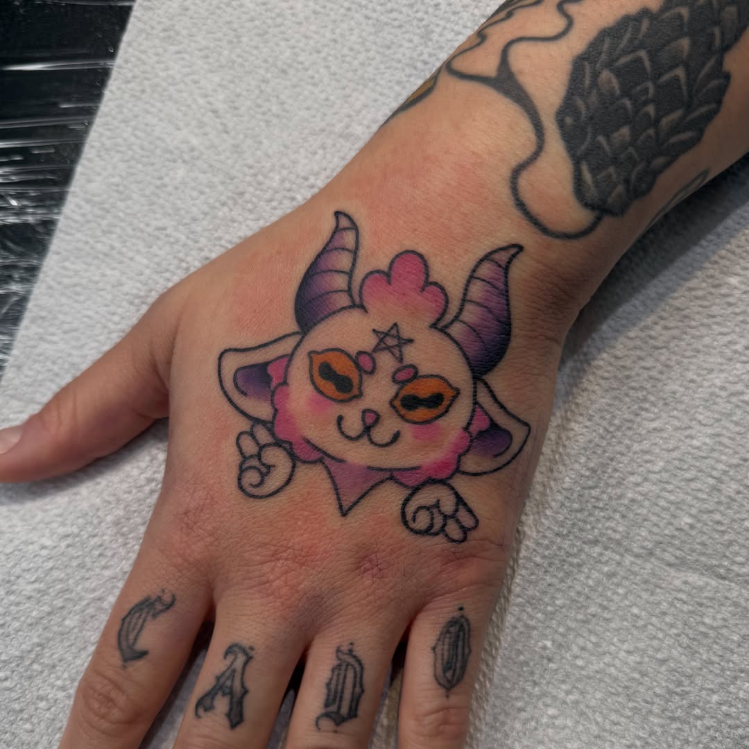 Cat demon new school tattoo on the hand by Mercy Dean