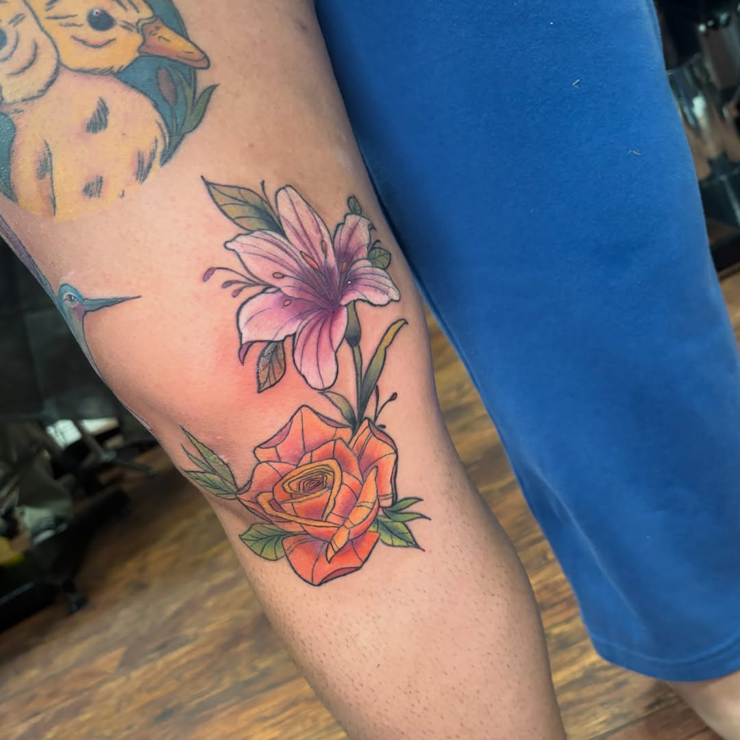 Lily and rose new school tattoo on the forearm by Emma ๐
