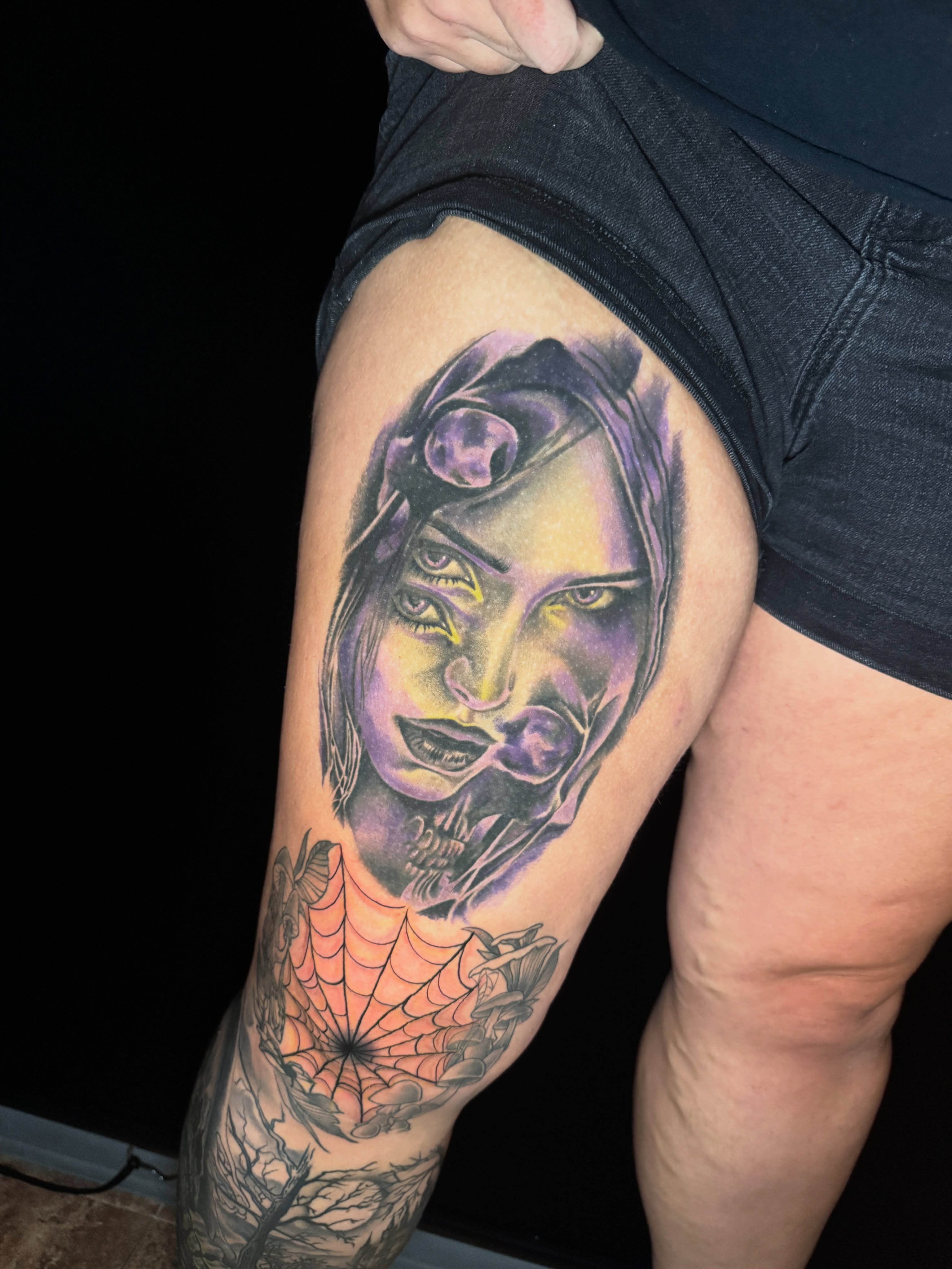 Woman with purple hood realism tattoo on the thigh by Shane Fowler, Massillon, Ohio