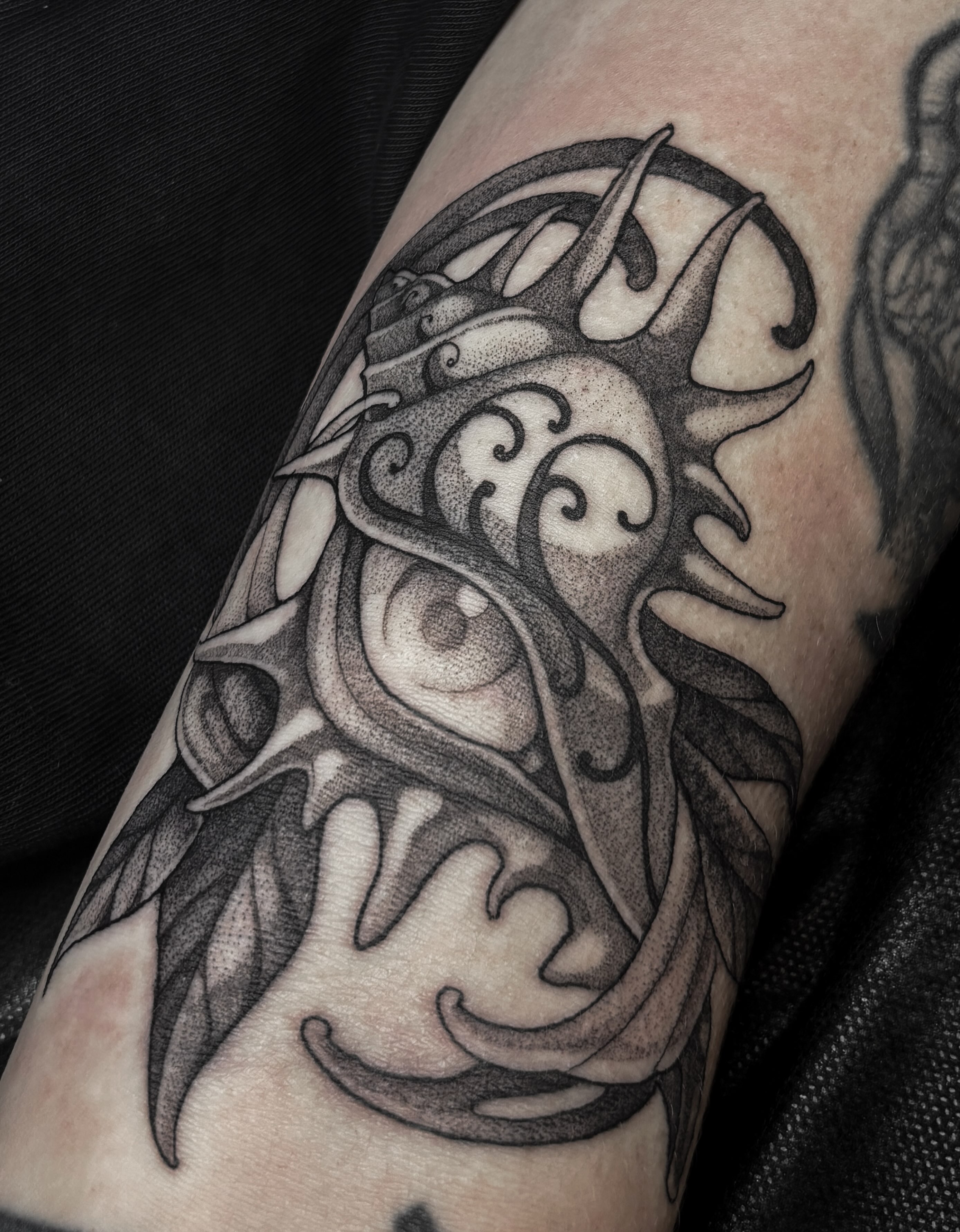 Eye with tribal patterns tribal tattoo on the forearm by Fairy Gremlin