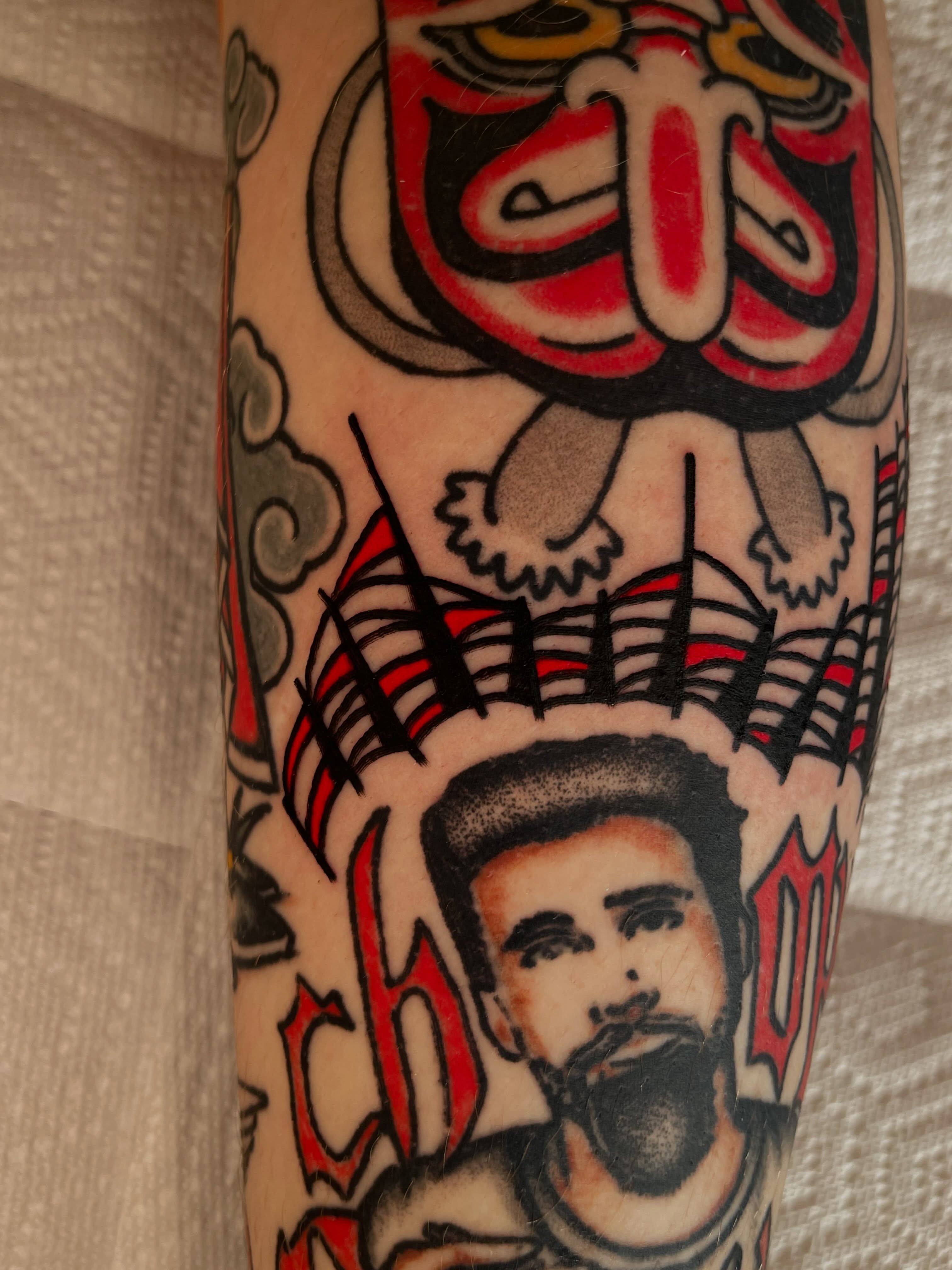 Portrait of man with beard American traditional tattoo on the forearm by Devyn Hightower
