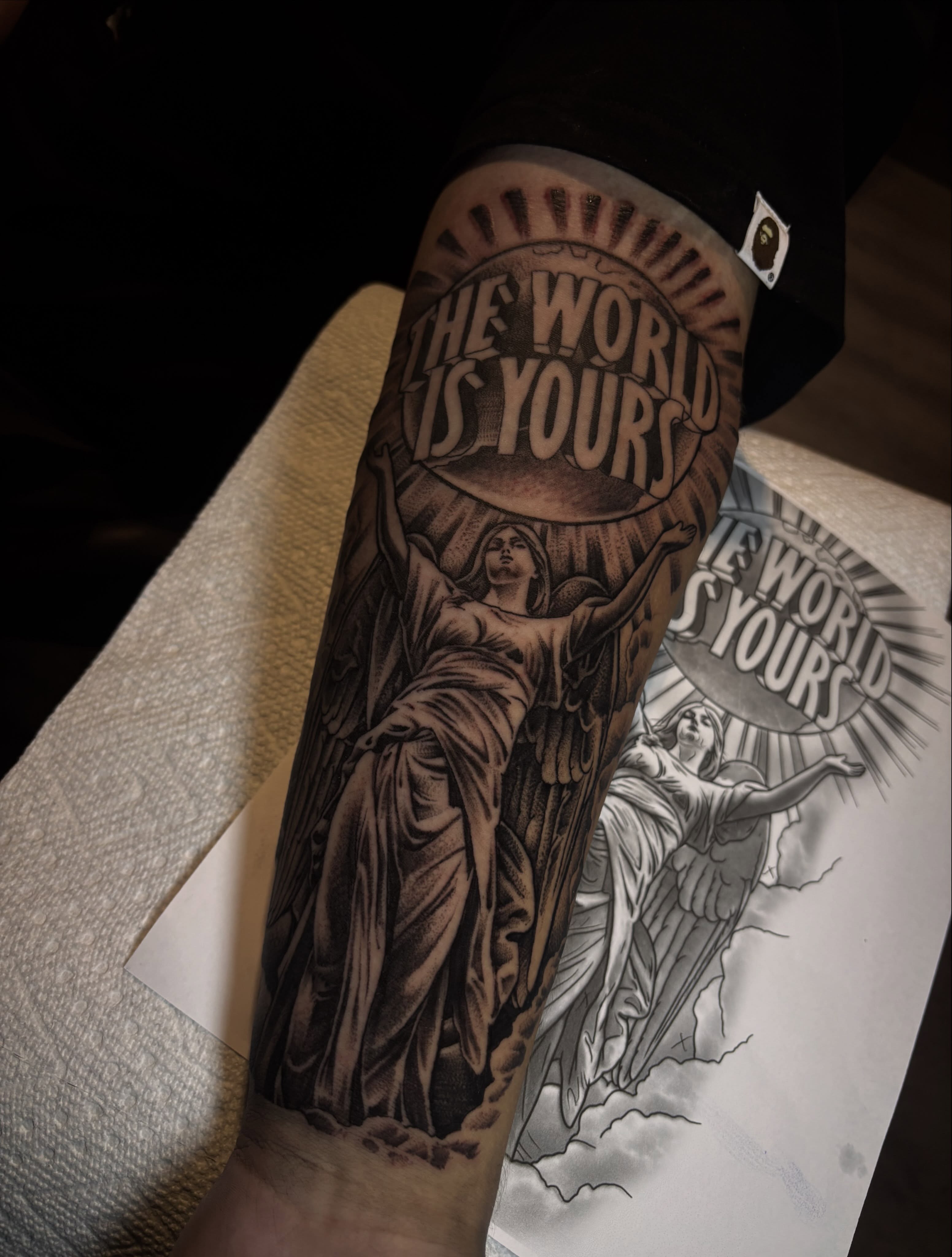 Statue with wings realism tattoo on the forearm by michael