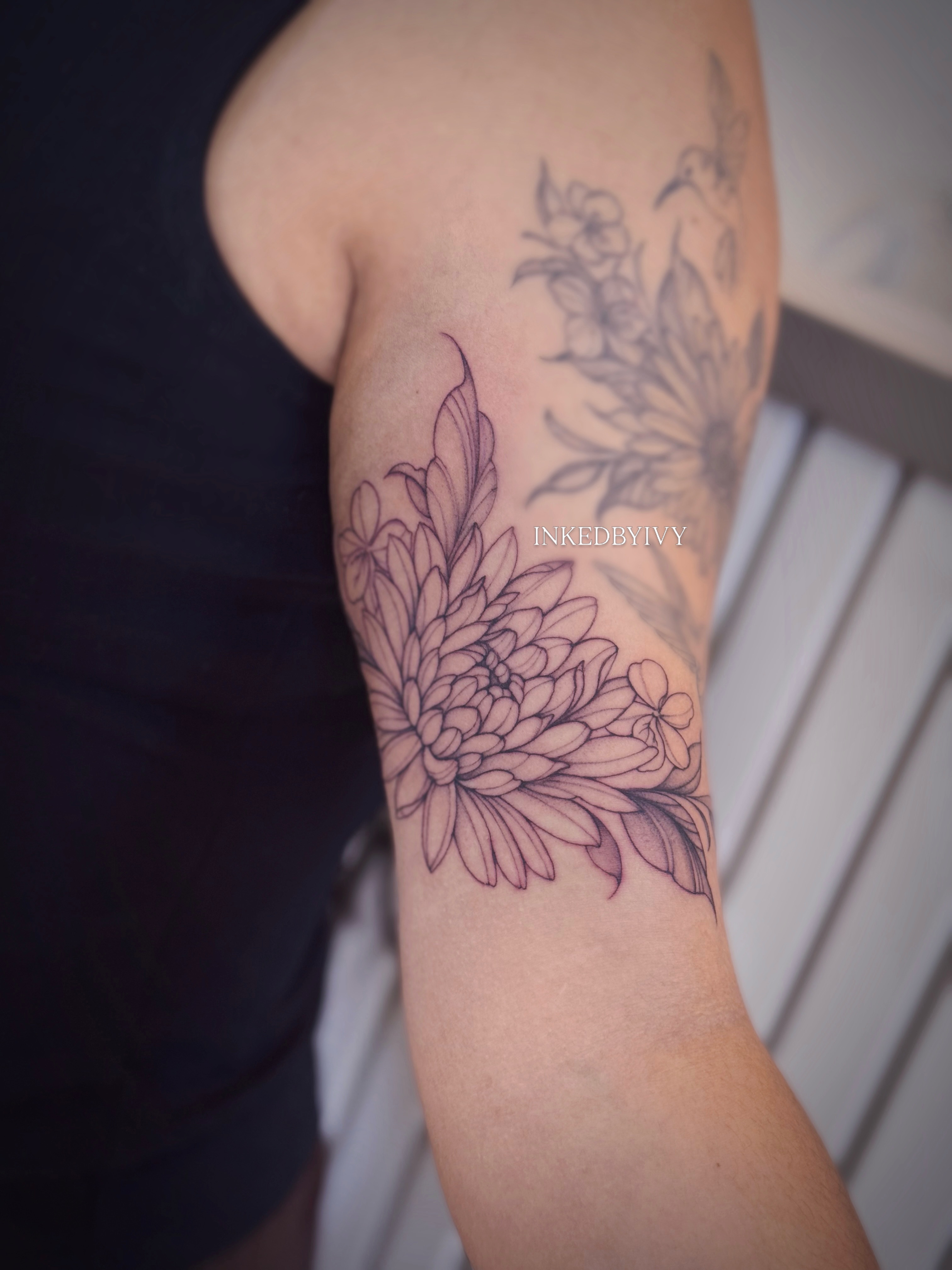 Chrysanthemum black and grey tattoo on the forearm by IVY
