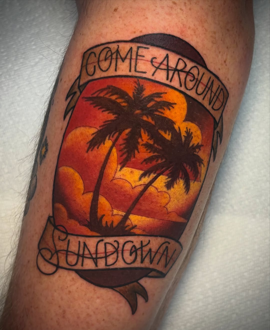 Sunset with palm trees American traditional tattoo on the forearm by ＊ 𝙴𝚁𝙸𝙺𝙰 𝚆𝙷𝙸𝚃𝙴 ＊ 𝙱𝙻𝚄𝙴 𝚃𝙾𝚁𝙲𝙷 𝚃𝙰𝚃𝚃𝙾𝙾