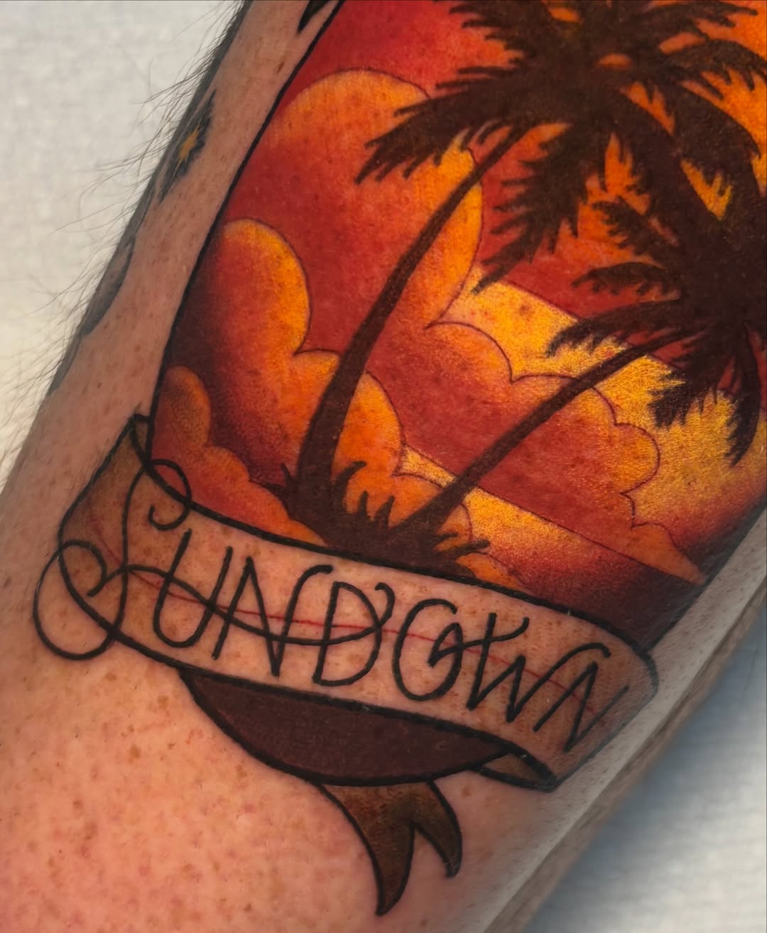 Sunset with palm trees American traditional tattoo on the forearm by ＊ 𝙴𝚁𝙸𝙺𝙰 𝚆𝙷𝙸𝚃𝙴 ＊ 𝙱𝙻𝚄𝙴 𝚃𝙾𝚁𝙲𝙷 𝚃𝙰𝚃𝚃𝙾𝙾